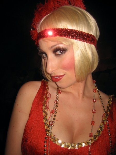  Leslie wearing red dress and headband and blond wig, backstage of  Die Fledermaus.  