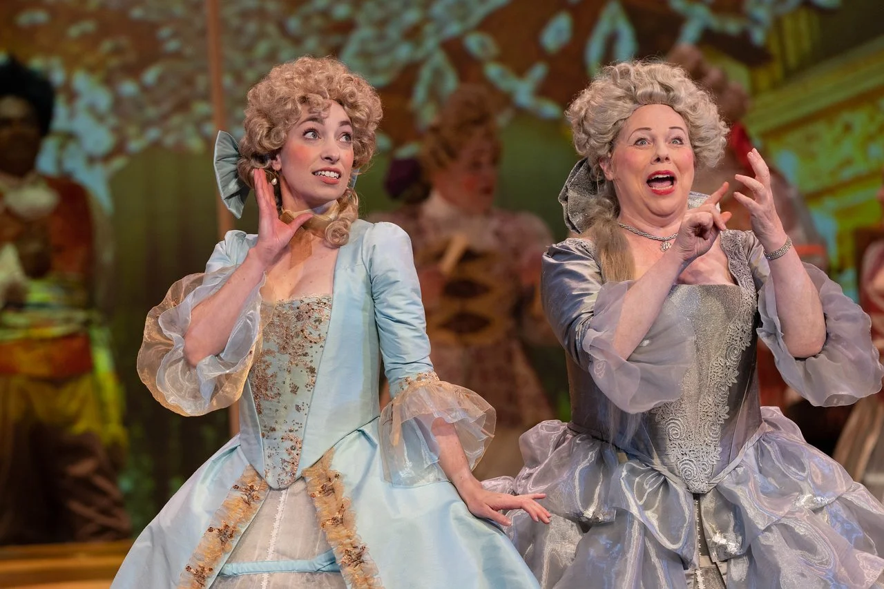  Leslie as Lady Lilette Sauvoirfaire, wearing a blue dress and blond wig, in  By Georges!  with Lamplighters Music Theatre, pictured with castmates. Photo by Joe Giammarco. 
