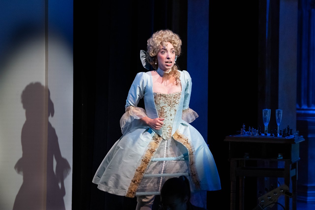  Leslie as Lady Lilette Sauvoirfaire, wearing blue dress and blond wig, in  By Georges!  with Lamplighters Music Theatre. Photo by Joe Giammarco. 