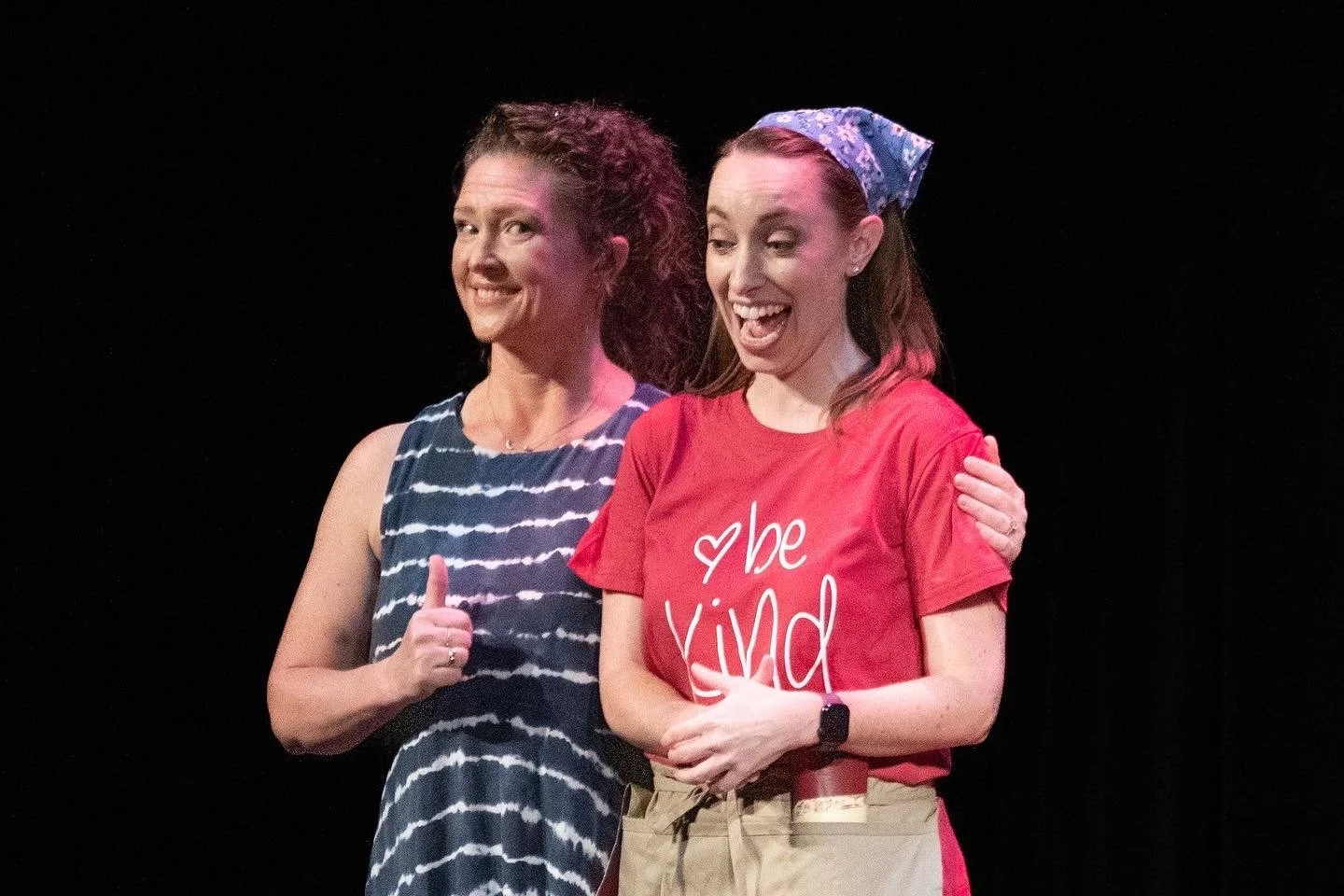  Leslie as Carrie ,  wearing red tee shirt and blue handkerchief,   in  Choirstarter  with Lamplighters Music Theatre, pictured with castmate. Photo by Joe Giammarco. 