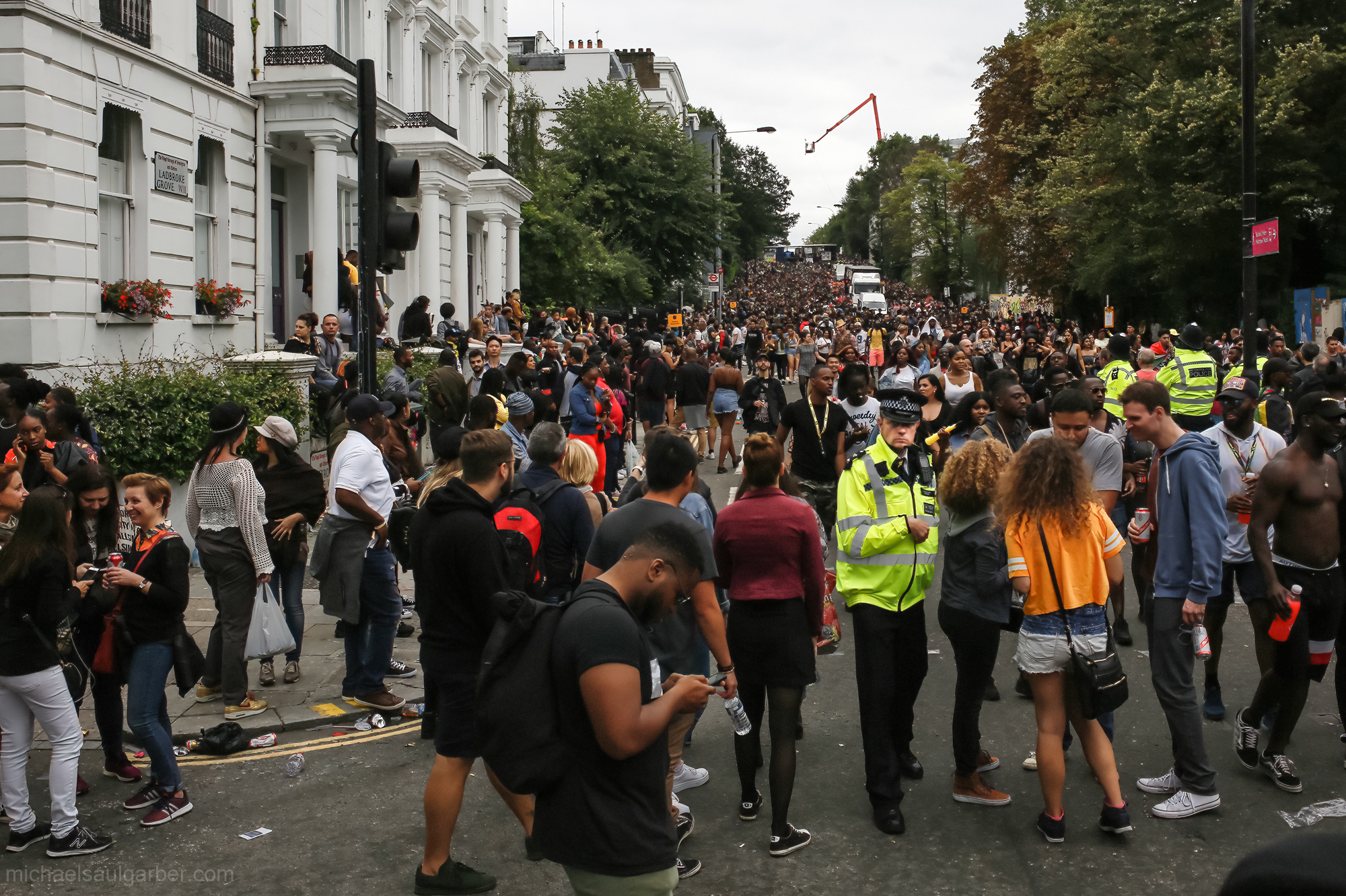 The London Police are ubiquitous throughout the Carnival, but their light touch creates a positive relationship with the crowd, Notting Hill Carnival, 2018