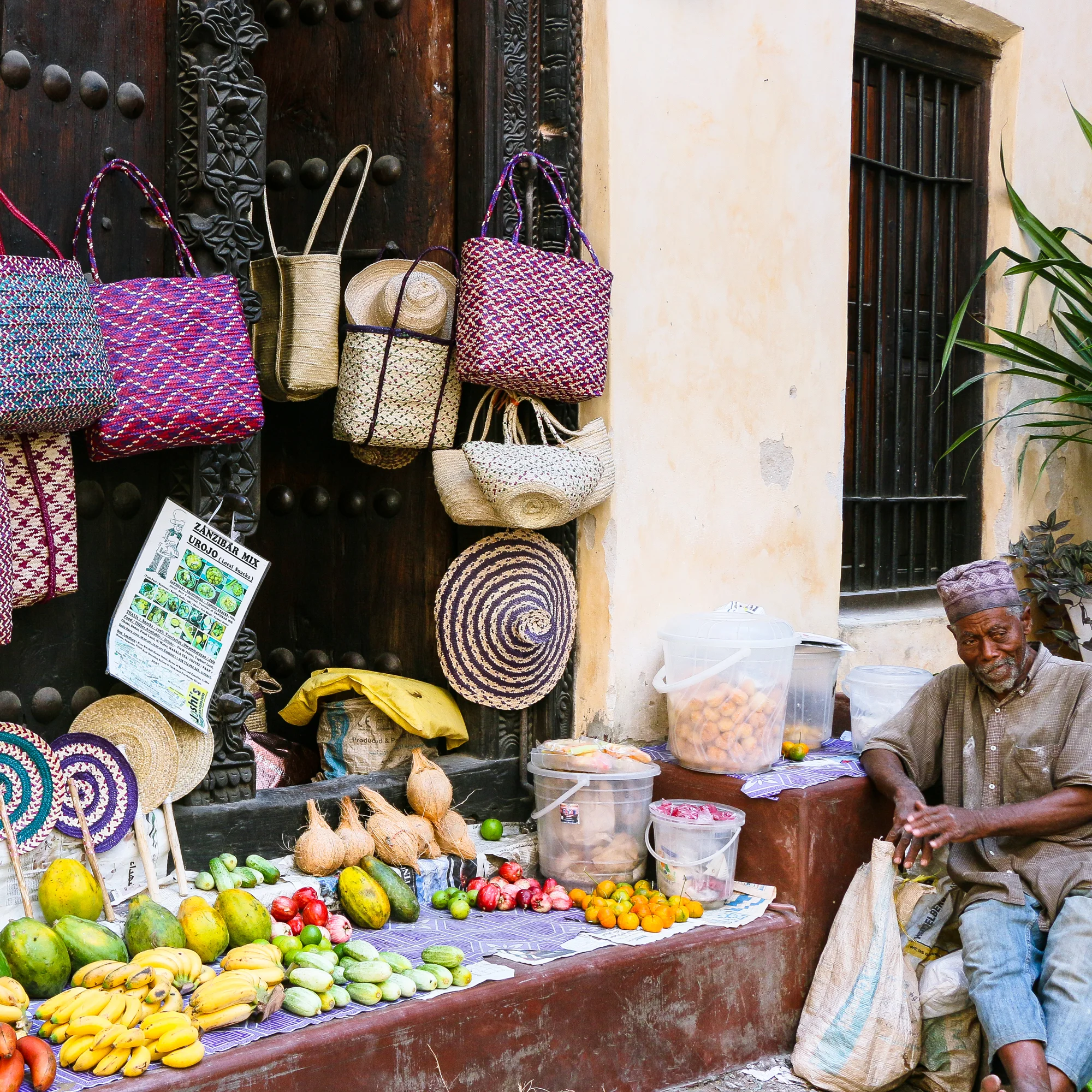 Colourful fruit and woven items Stone Town Zanzibar