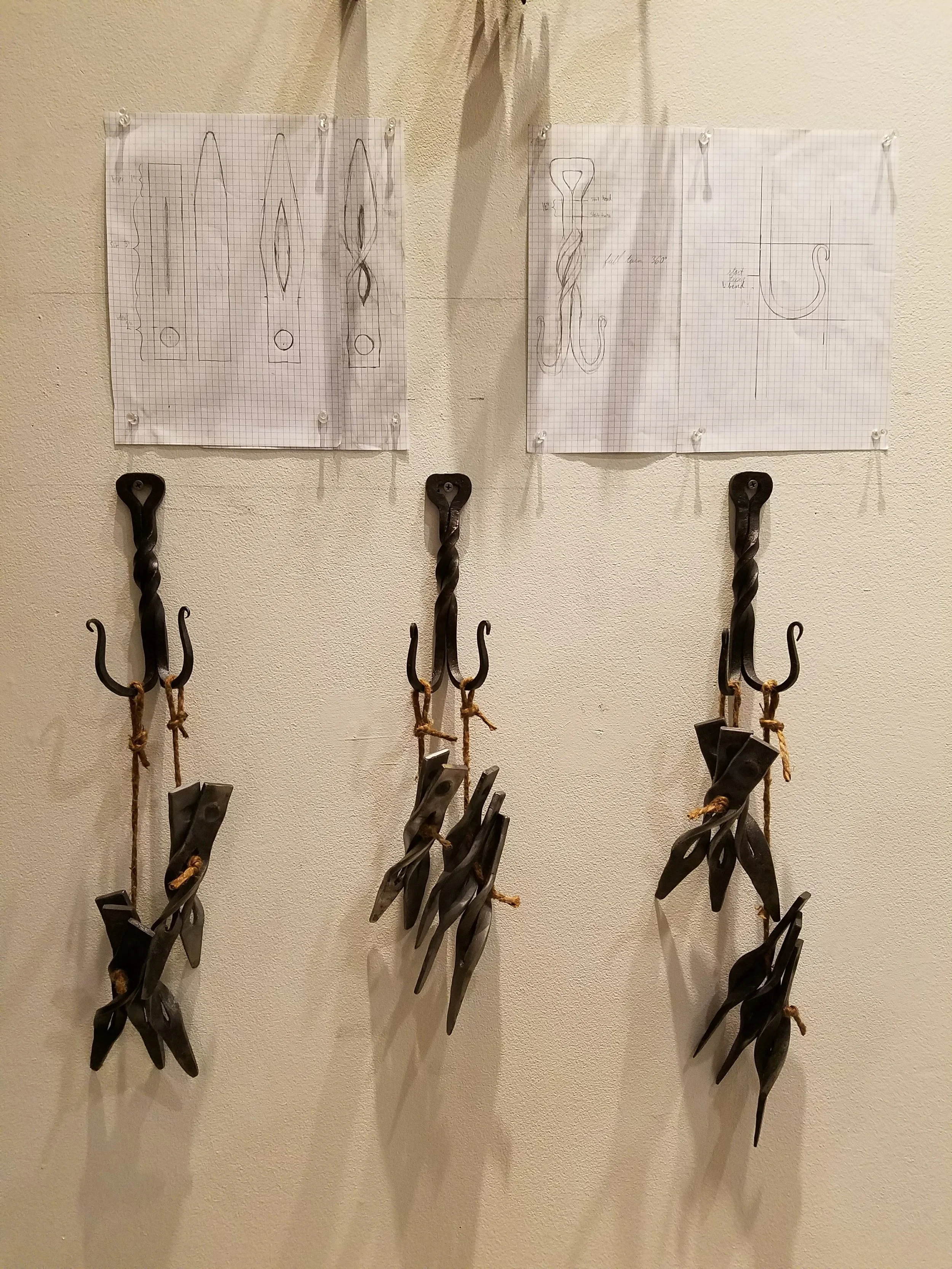  Original designed and forged sets of hooks and kissi pennies (iron currency). 