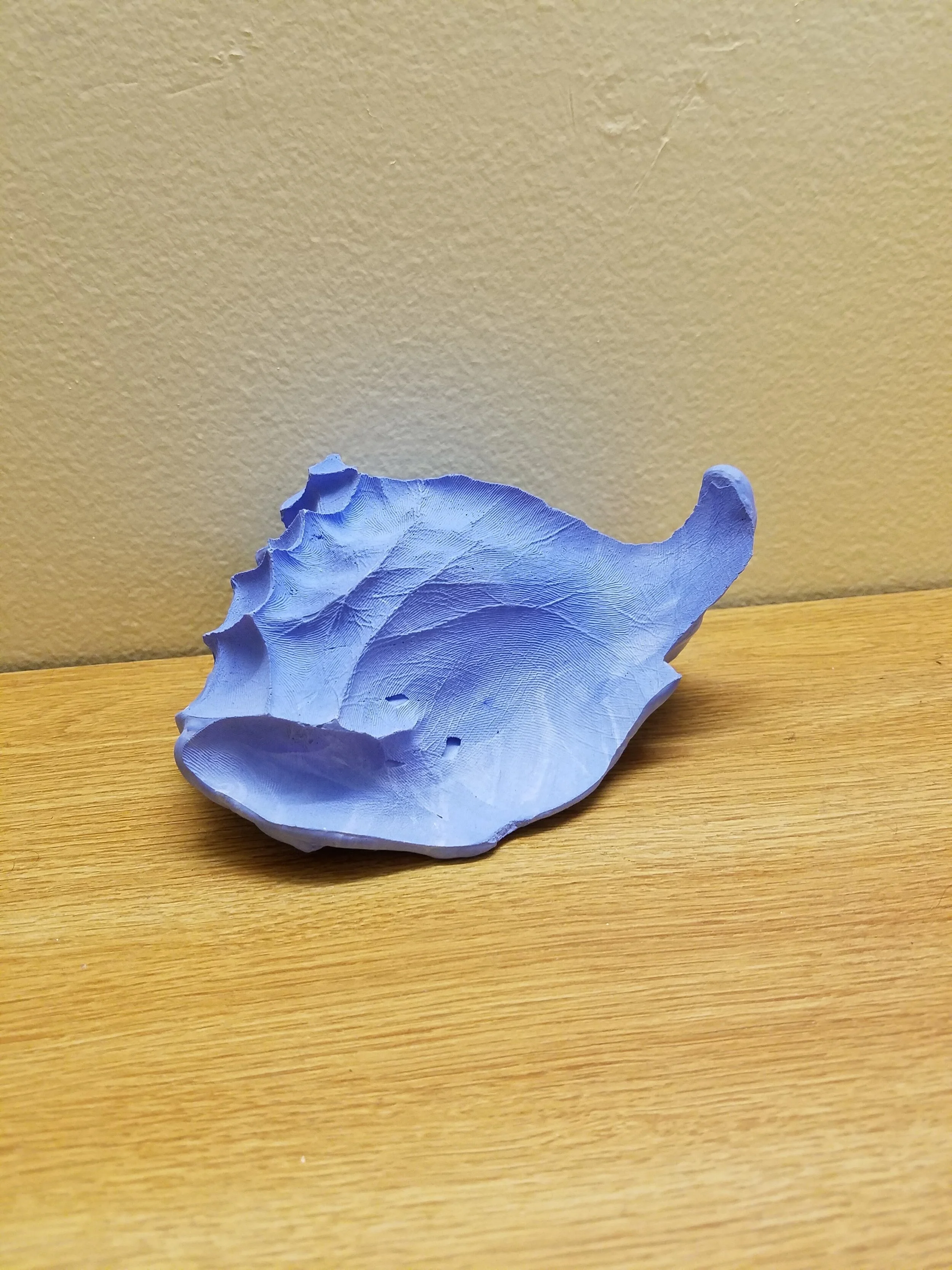  Cobalt plaster shell from the negative space of begging hands 