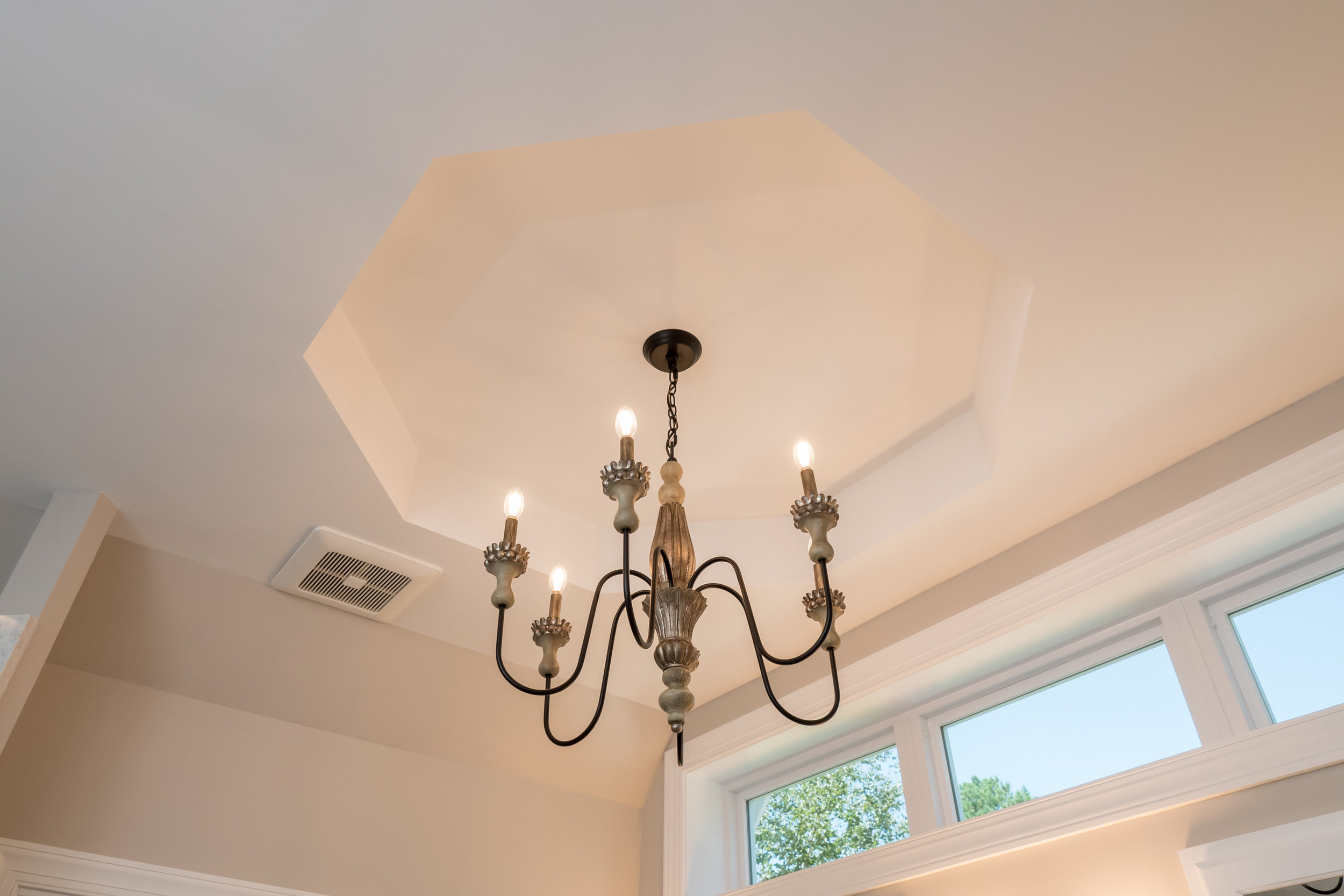 classy bathroom remodel + chesapeake + chandelier + benson Homes.jpg