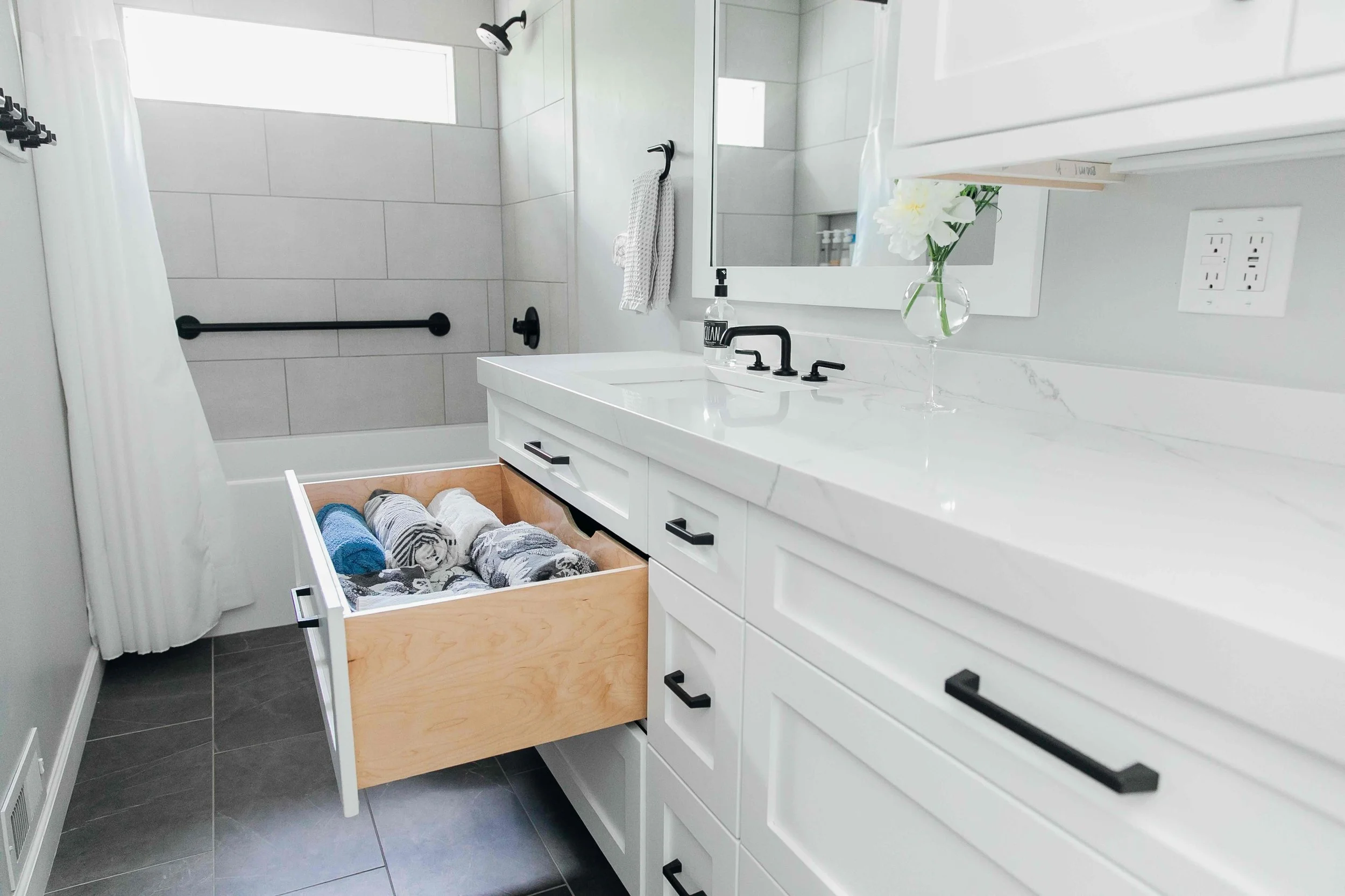 White and slate bathroom in 1960s ranch home