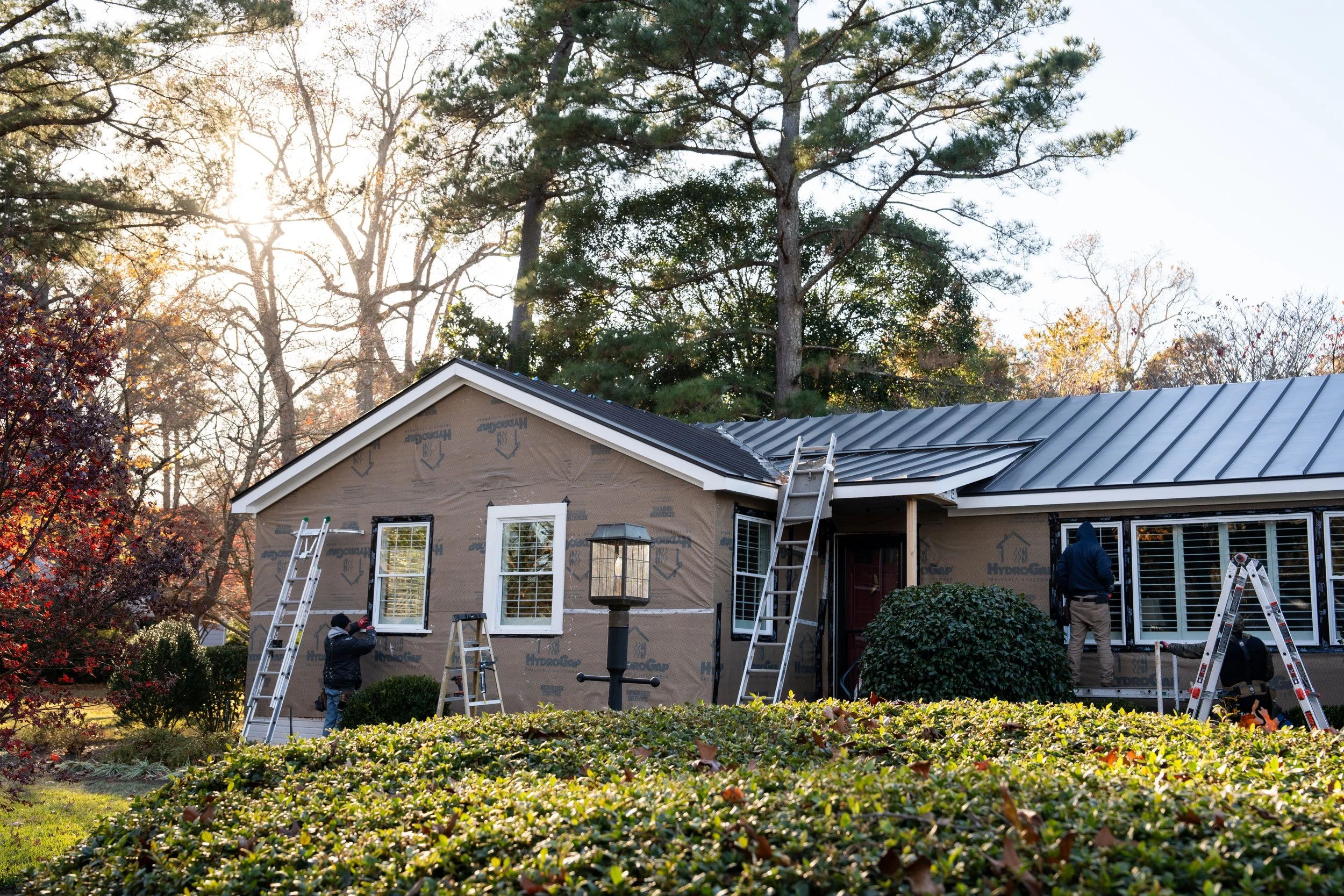Cedar siding in-process on bay colony ranch home