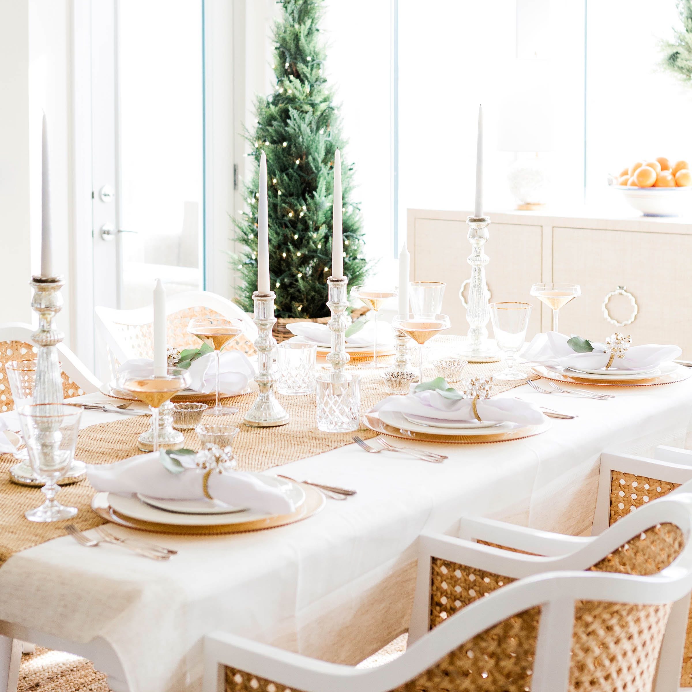 Cozy and elegant table setting by christmas tree