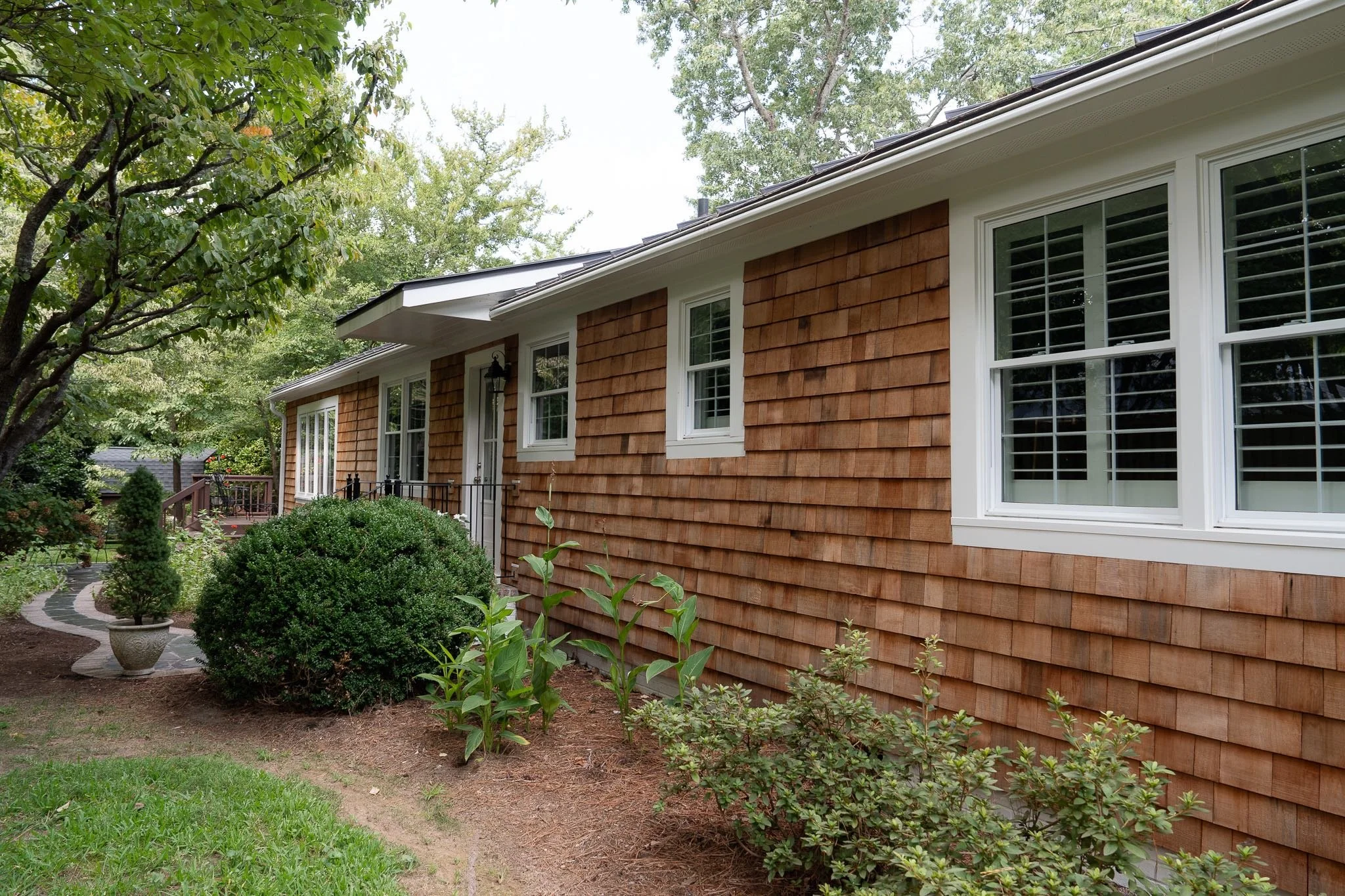 Back of ranch-style home with western red cedar siding