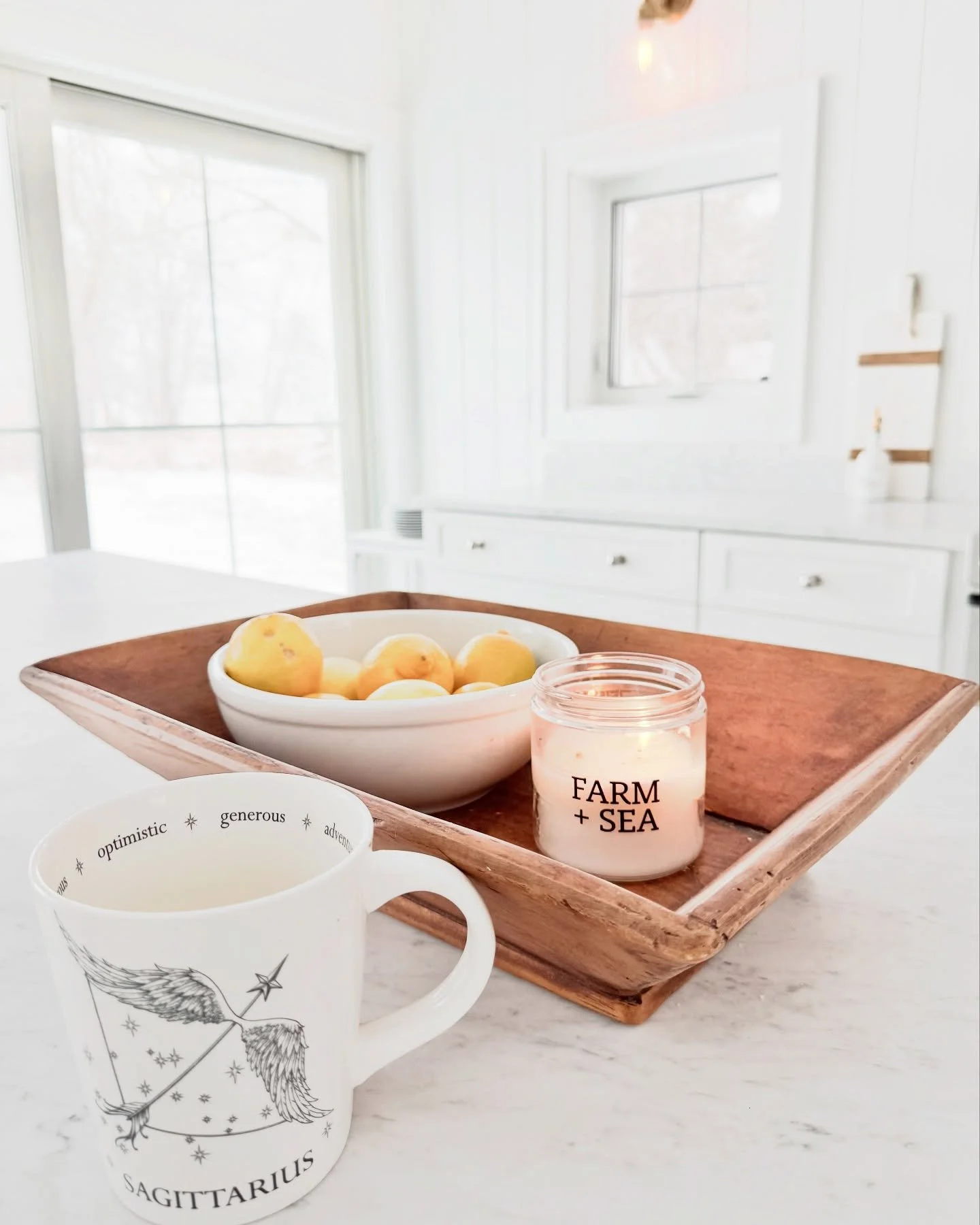 Cozy snowy morning in my favorite kitchen spot, with my fav mug of tea, and my fav @farm_sea candle. 🤍 #cozyhome #snowday #whiteinterior #brightandlight #allmyfavs