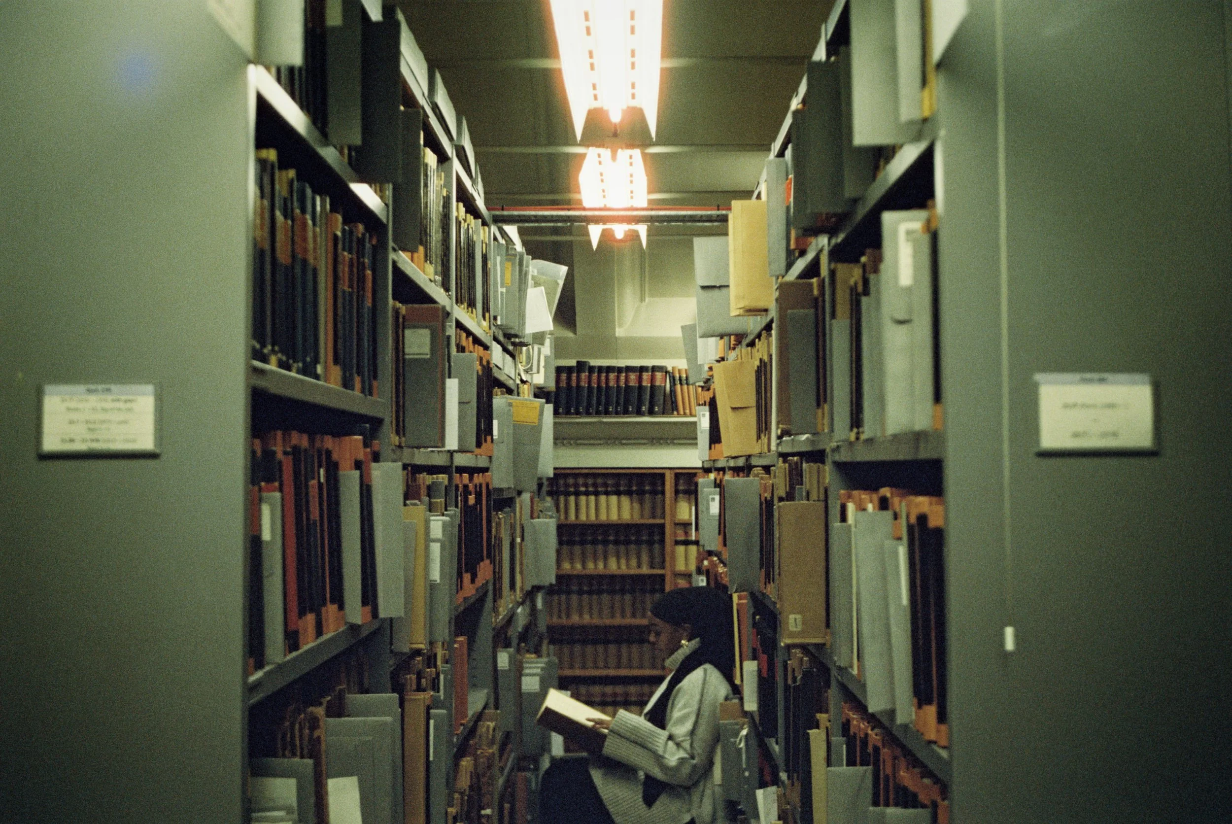 Amina in the archive.jpg