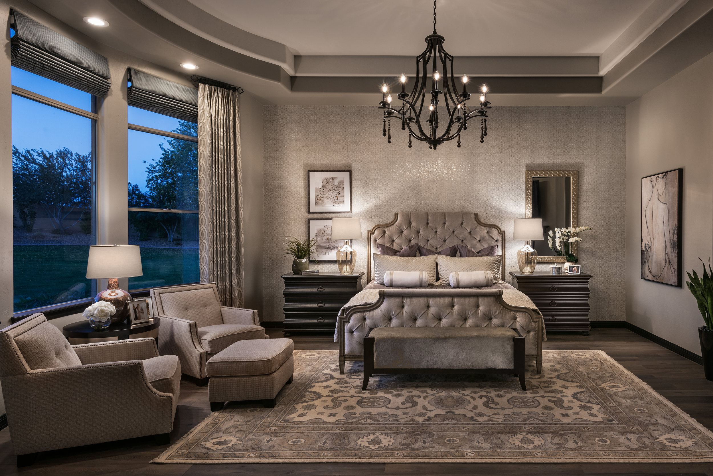 Adding sparkle to this room with embellished wall-covering on the headboard wall along with the new chandelier this master bedroom comes to life.