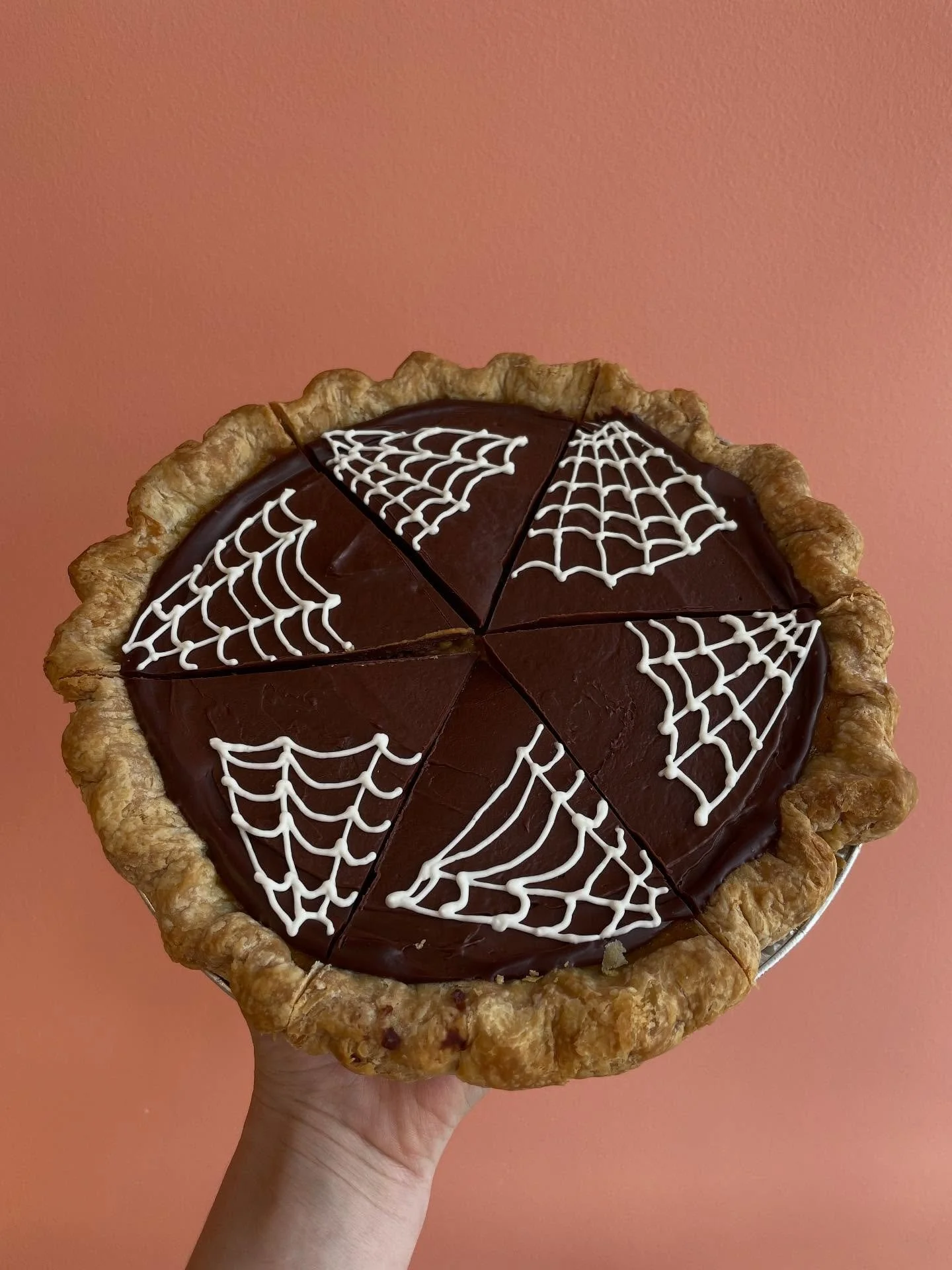 My team watched me struggle HARD with these spiderwebs on our Spooky Pumpkin Pie, it was quite sad. But I made it out the other side 💪 Pumpkin pie gets a layer of chocolate ganache and a spooky cream cheese spiderweb. It&rsquo;s a perfect combo! Get