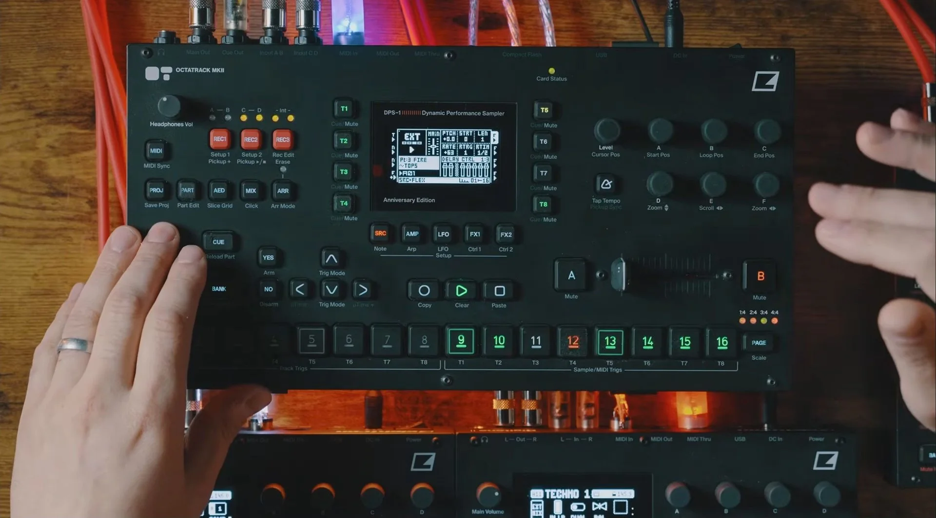 EZBOT demonstrating a four-stem Hybrid 4X4 setup on the Octatrack MKII, with his hands over the performance controls.