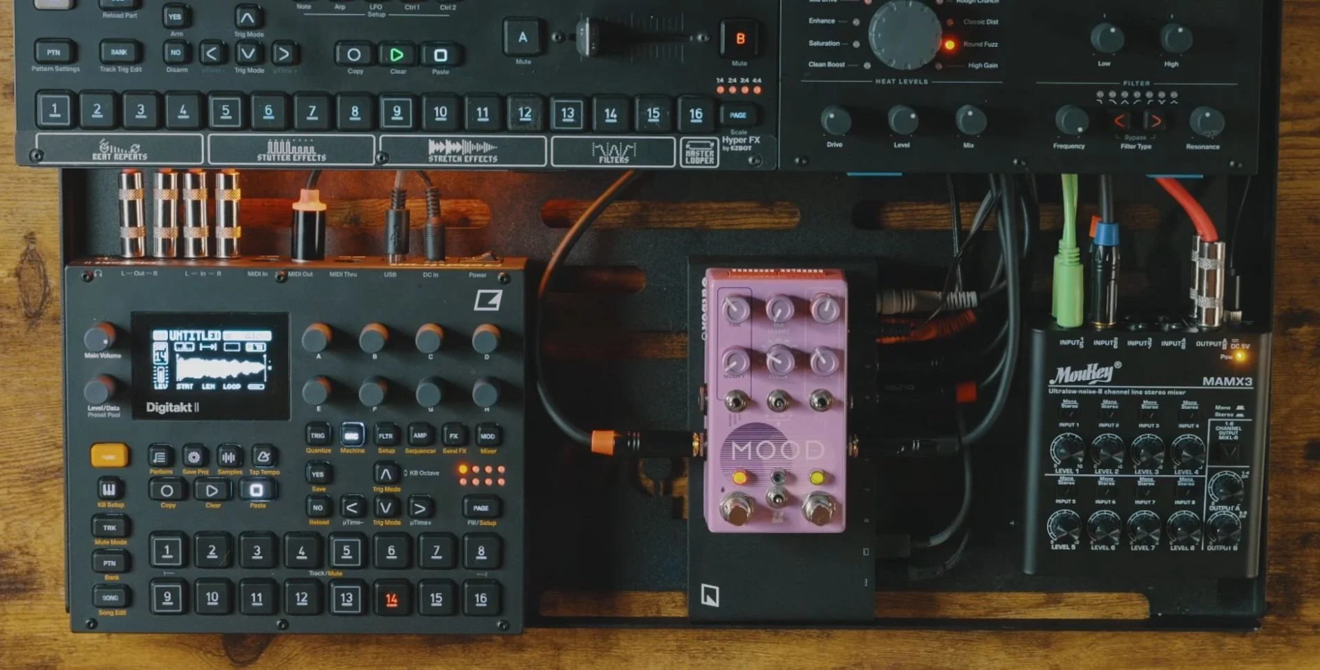 Digitakt II sampler, MOOD MKII pedal, and compact mixer connected beneath Octatrack and Analog Heat +FX in the Outbox 8 routing setup.