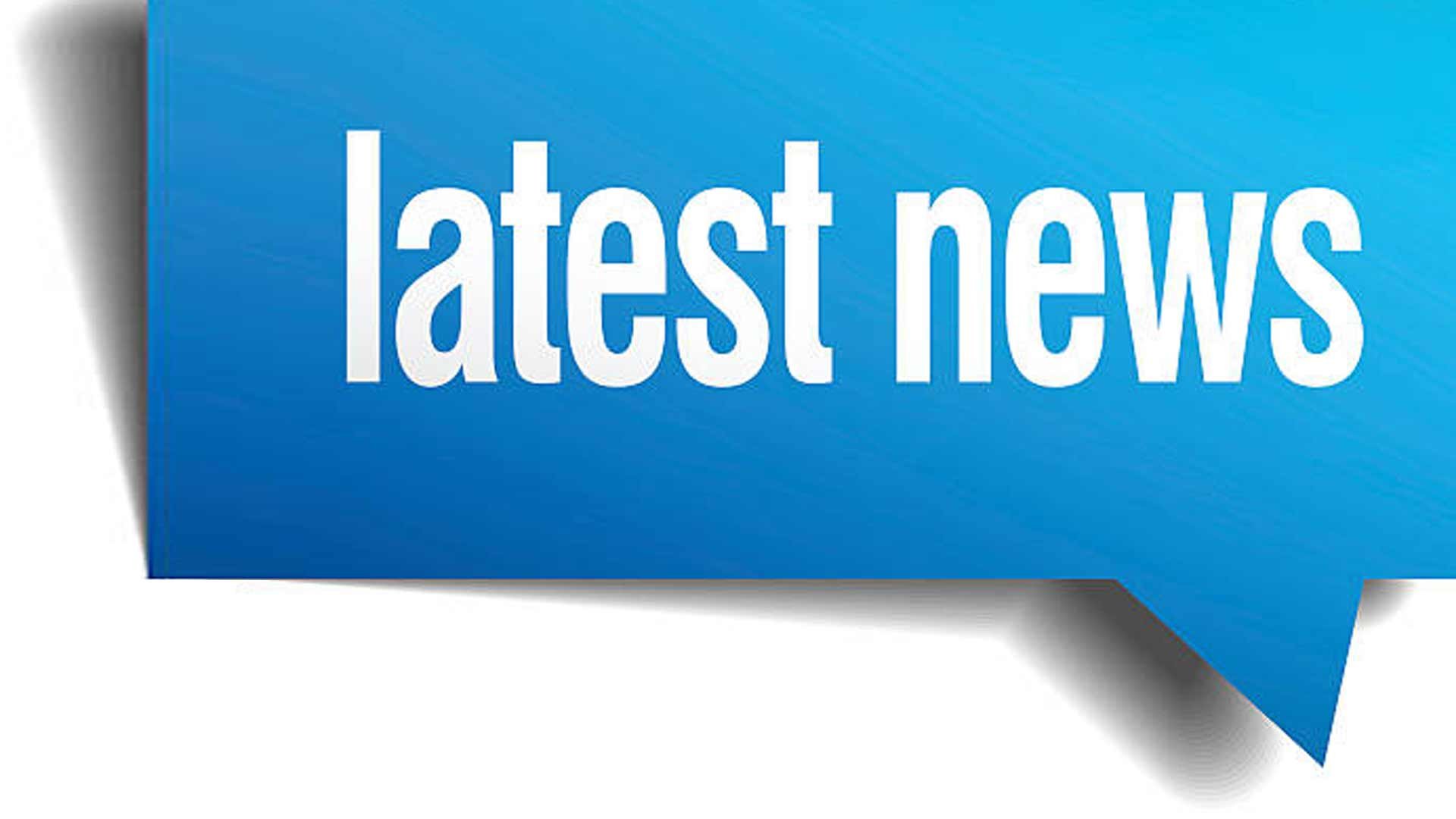 Close-up of a blue sign with white text reading 'latest news' against a white background.