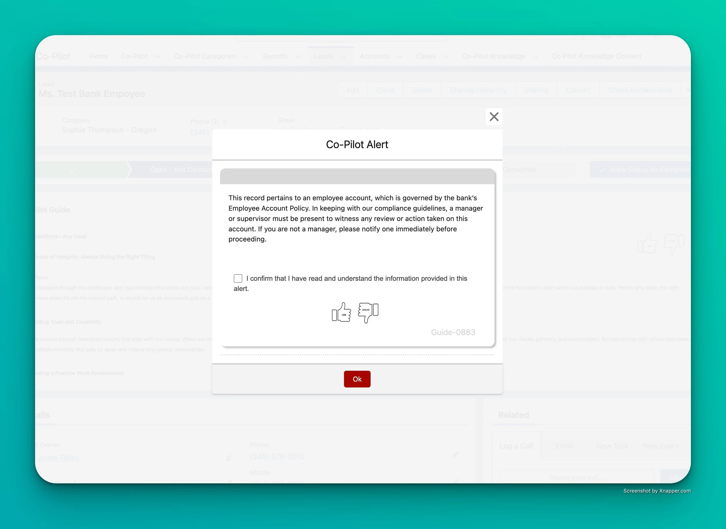 Alert pop-up window on a computer screen with information about employee account policy, including a checkbox to confirm understanding and a red 'Ok' button.
