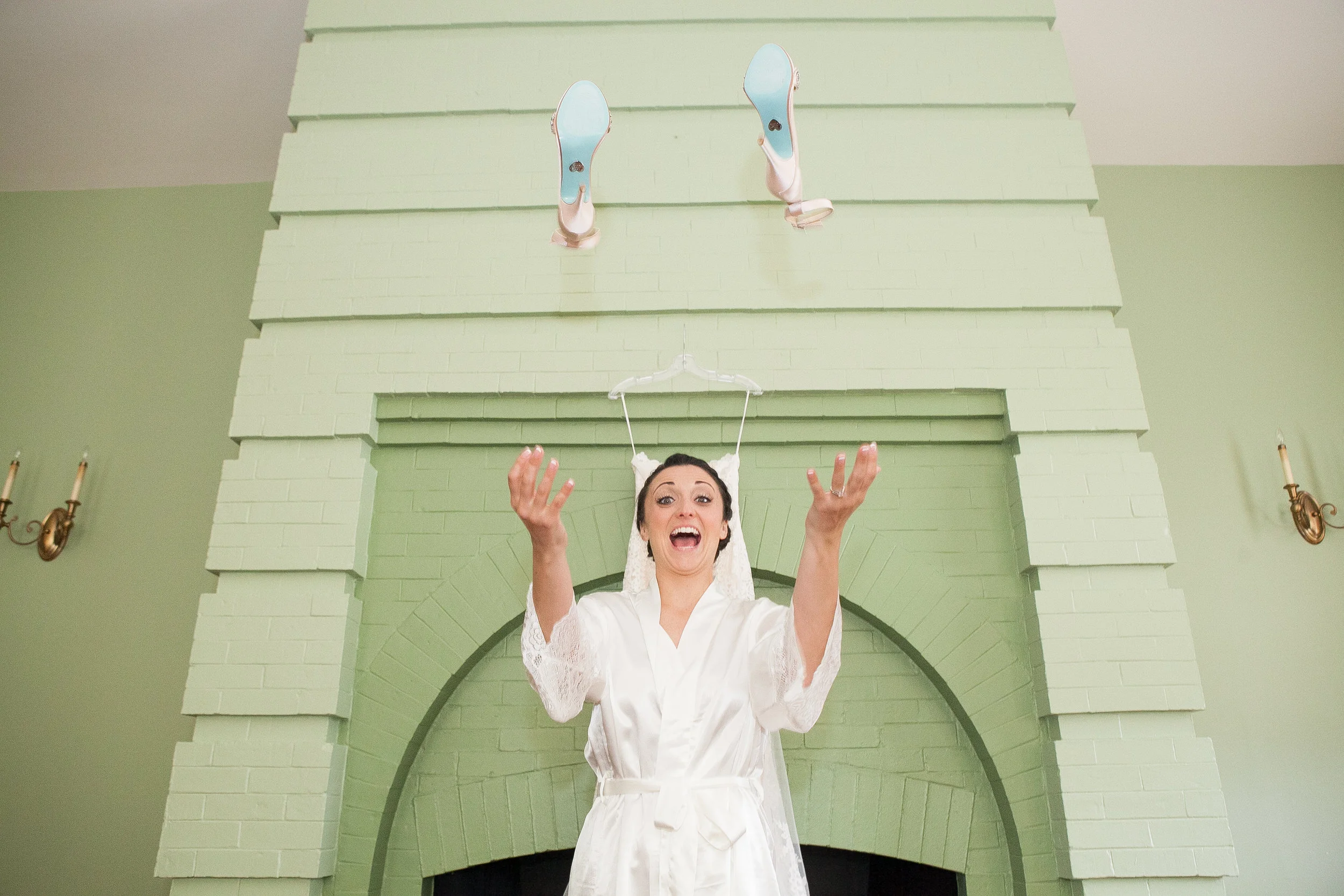 Bride tossing her shoes in the air