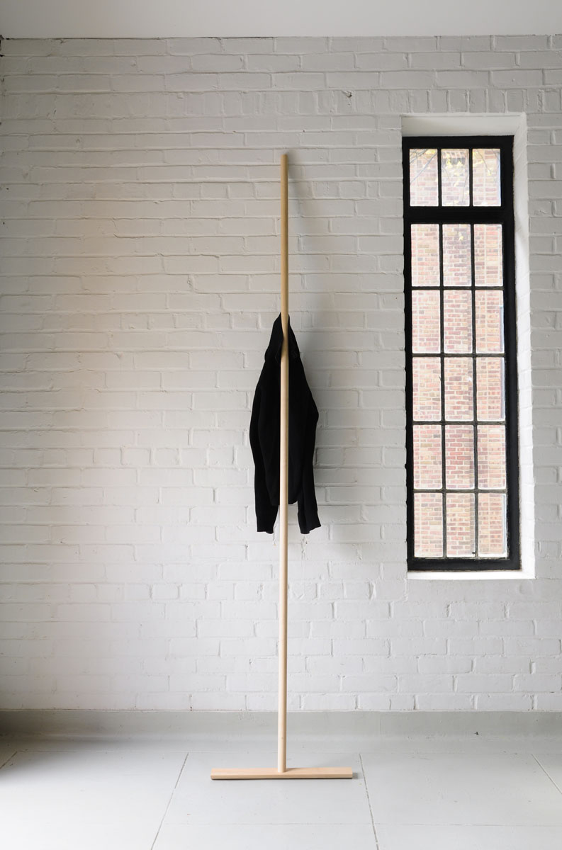   Coatrack  by Isaac Yu Chen  In the same manner that we lean a broomstick against the wall, this design investigates the gesture of pivoting the stick in order to access the hanging clothing. 