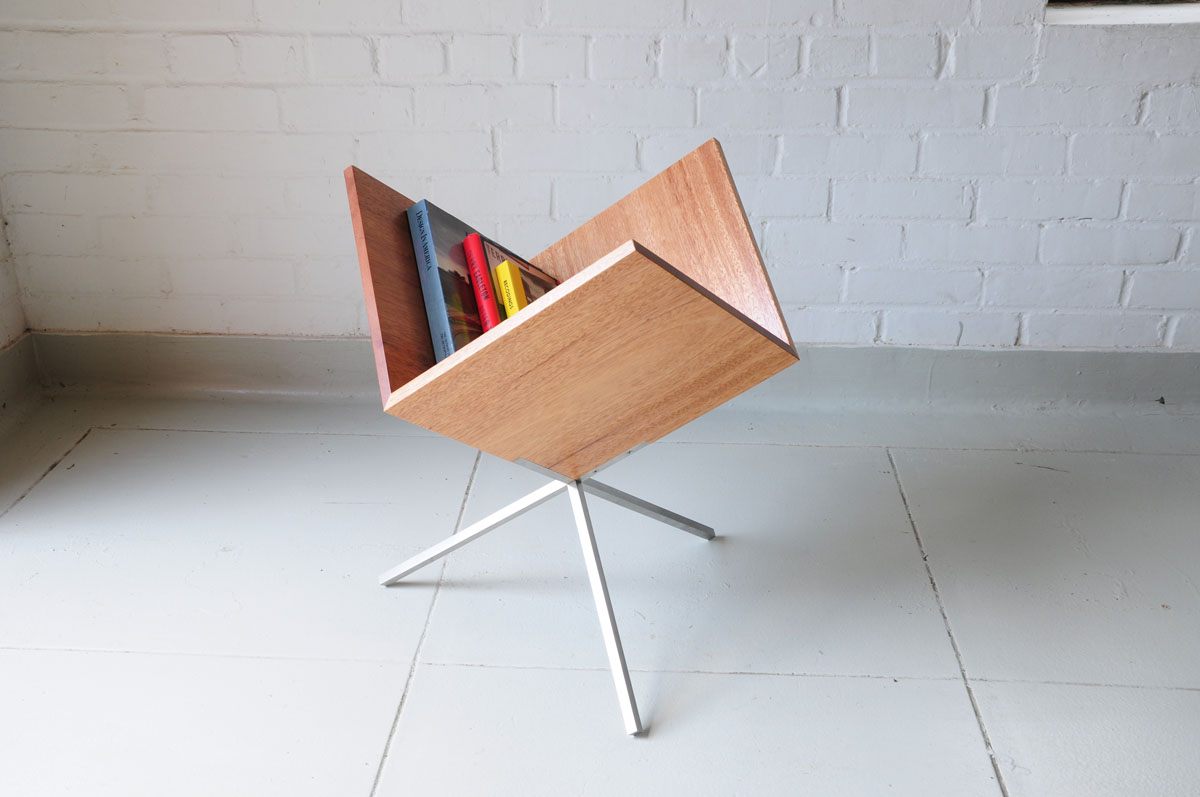   Triad by Talha B. Khwaja  A reduced cube is turned on its corner to function as a three-legged cabinet, allowing multiple modes of use. 
