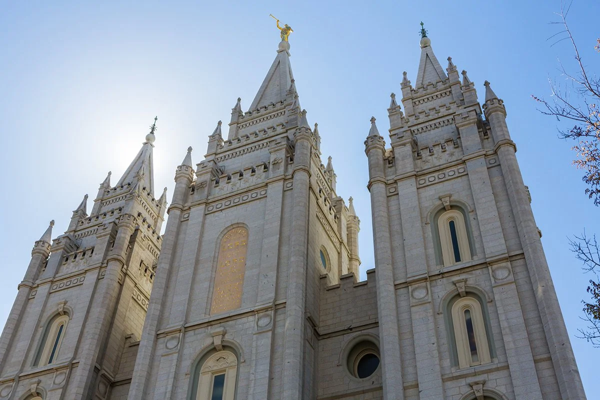 Spires of the Salt Lake Temple against a blue sky