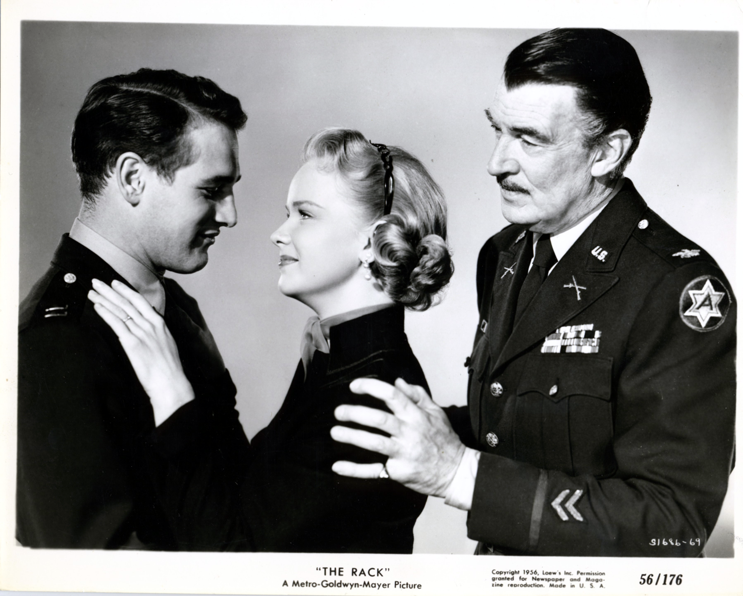  Paul Newman, as “Capt. Edward Hall, Jr.”, Anne Francis, as his wife, “Aggie”; and Walter Pigeon, as his father, “Col. Edward Hall, Sr.” 