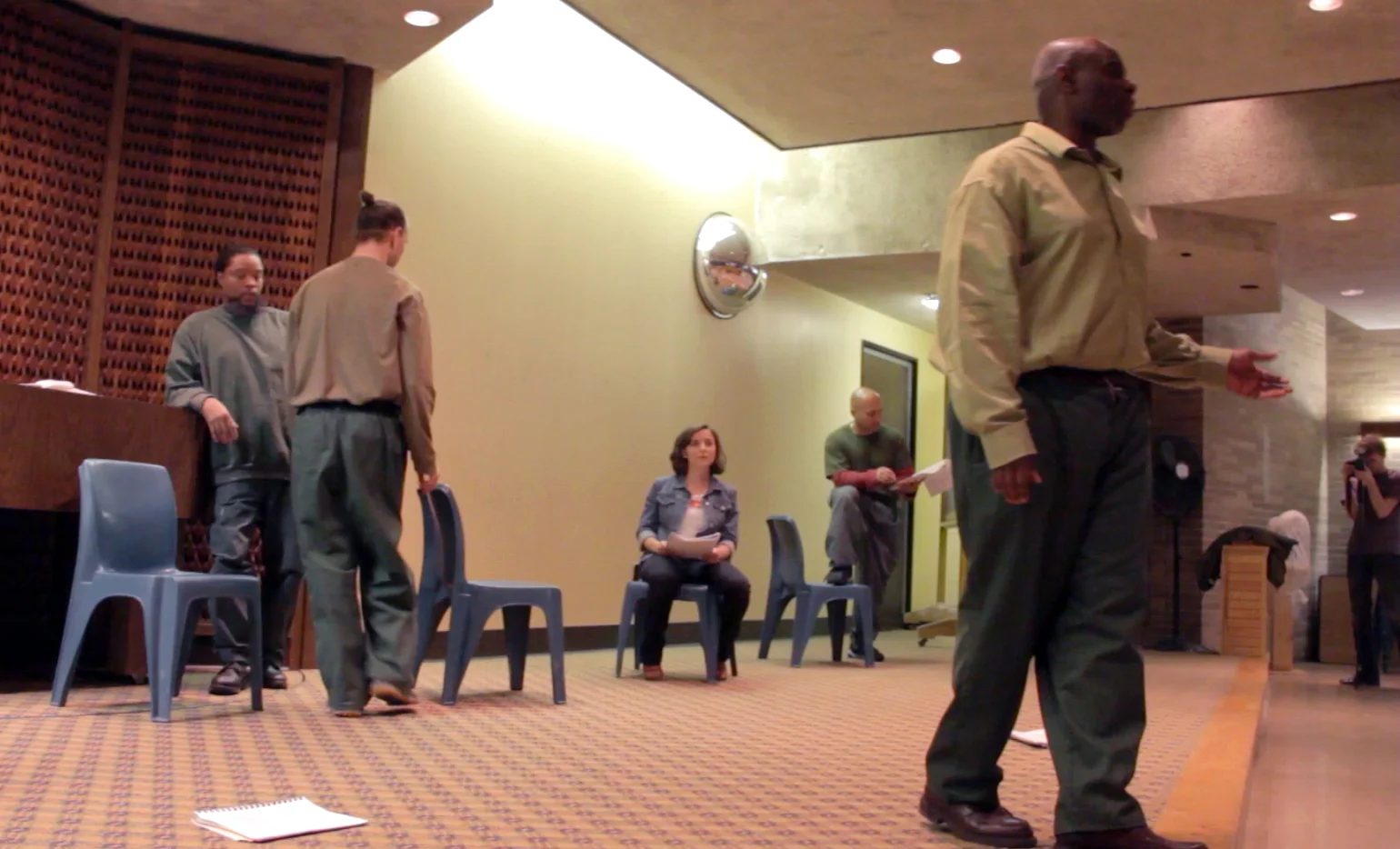 The group rehearses for the performance in the chapel.
