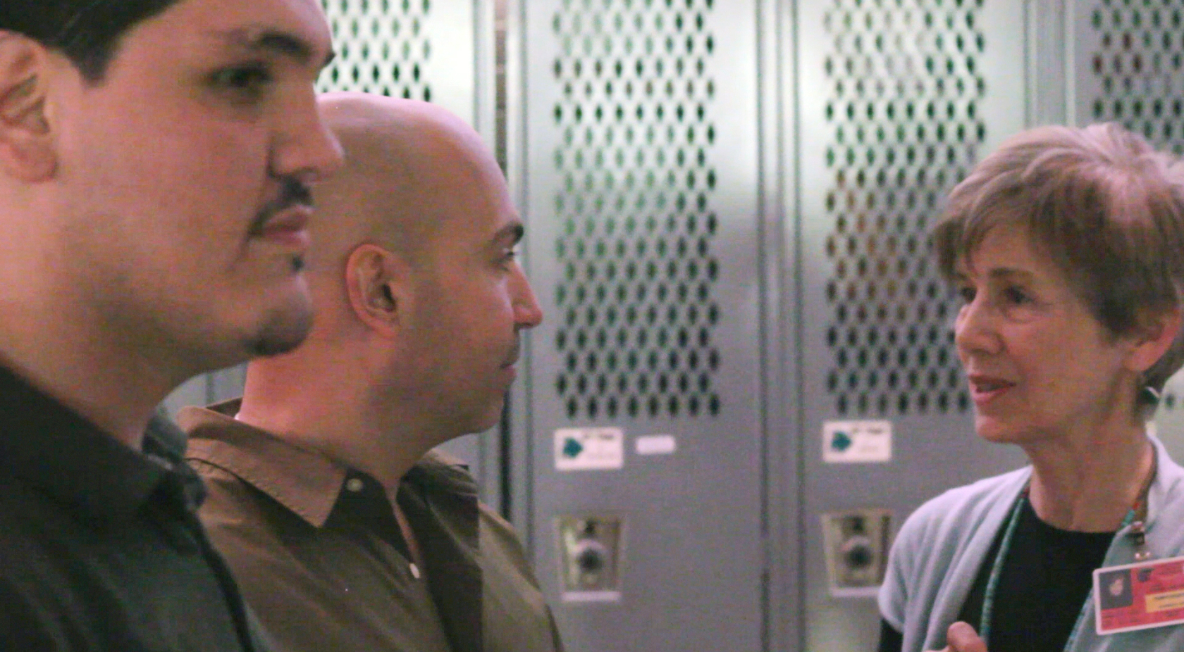 Alison speaks with David and De before the performance.