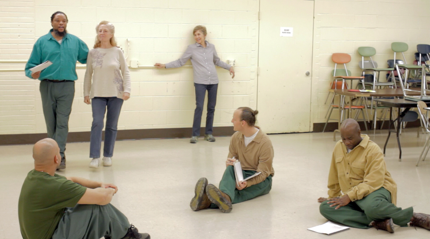 PPTG rehearses a group piece while facilitators Judy Levitt and Alison Van Dyke look on.