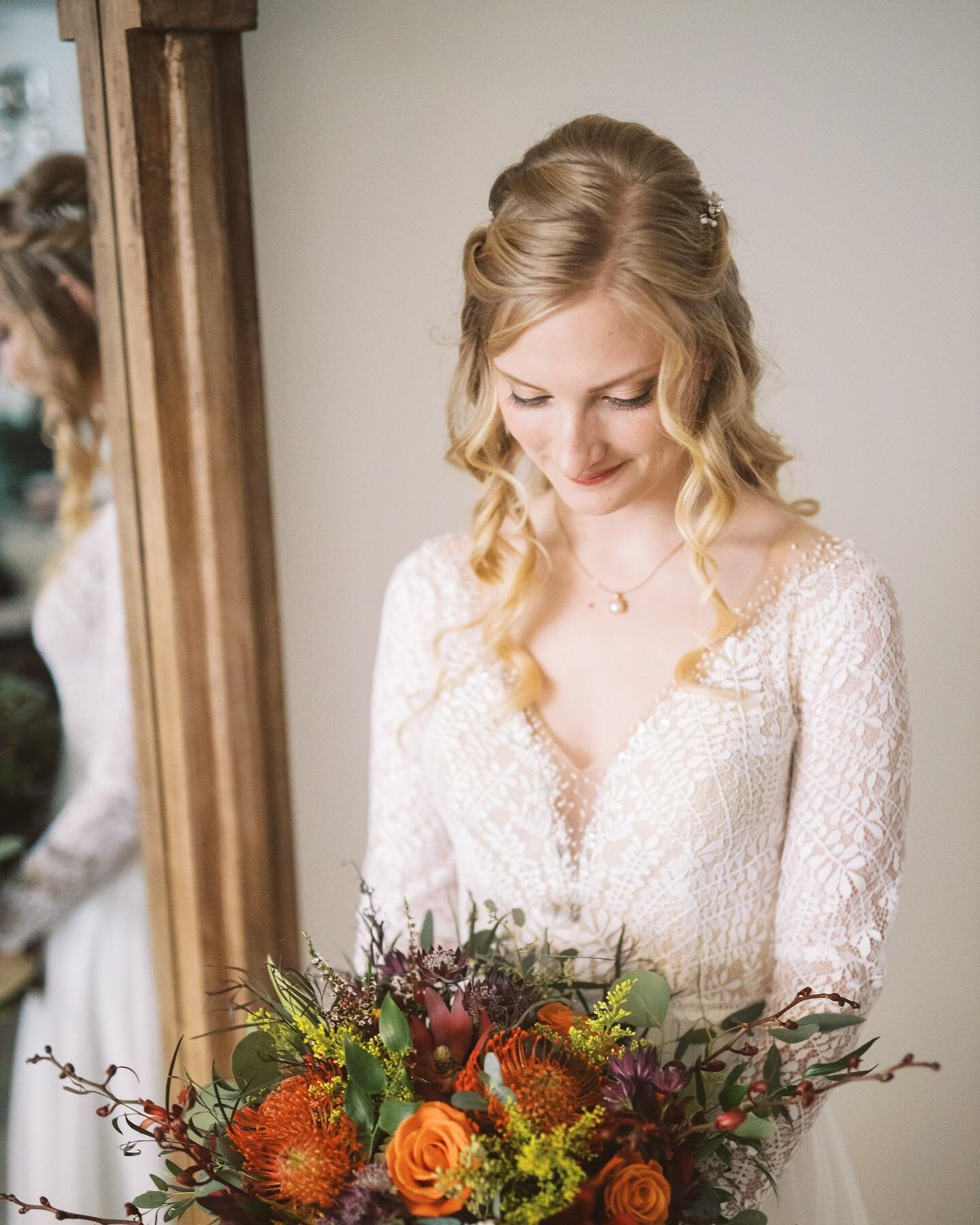 Beautiful real bride Georgia wore a long sleeve A-line wedding dress with cotton leaf lace and light hand beading at the neckline and illusion back, the chiffon skirt has delicate box pleats for an elegant detail. We love how she paired this dress wi