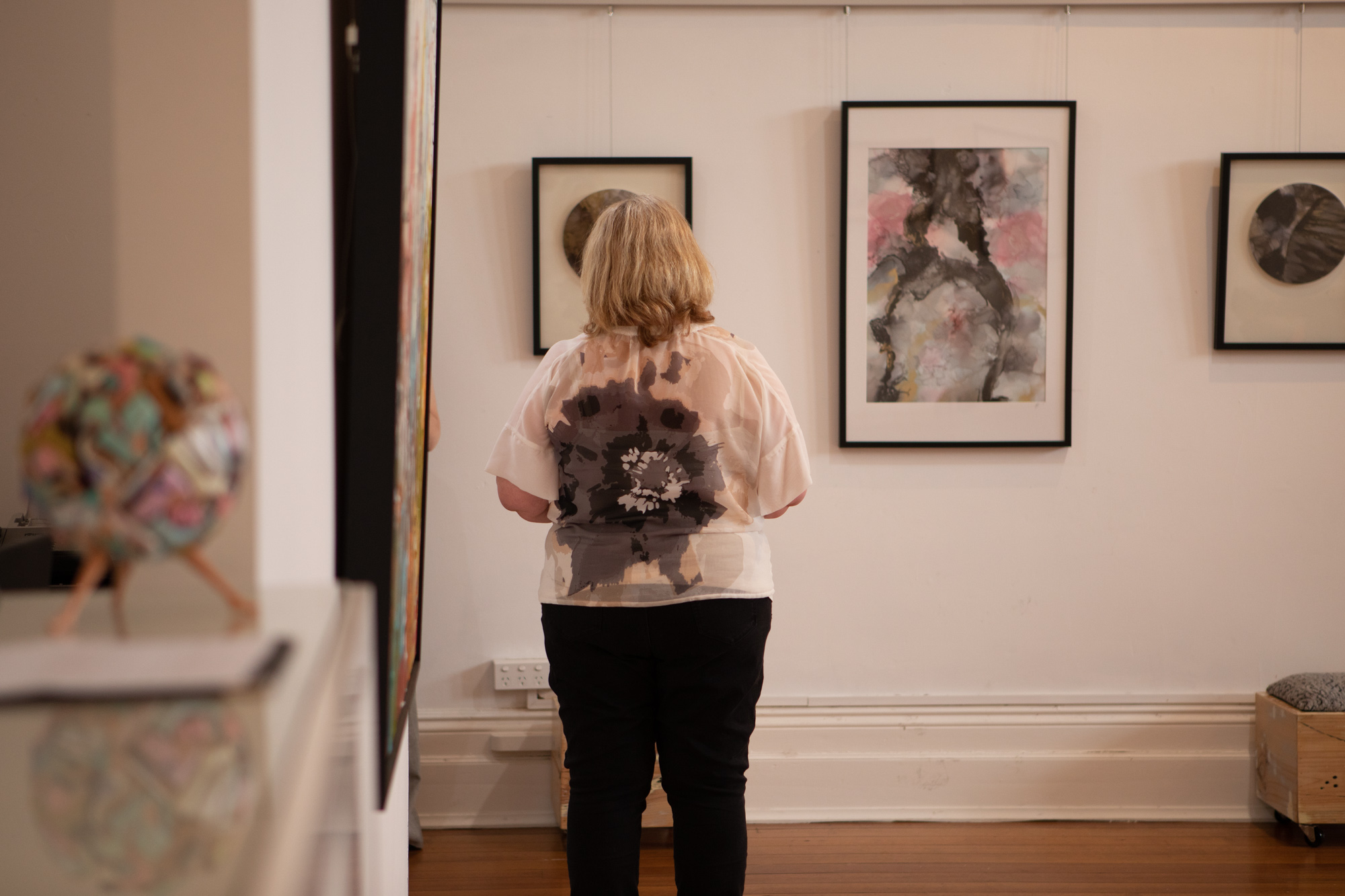 Artist Kate Wise observing Megan Sullivan's work