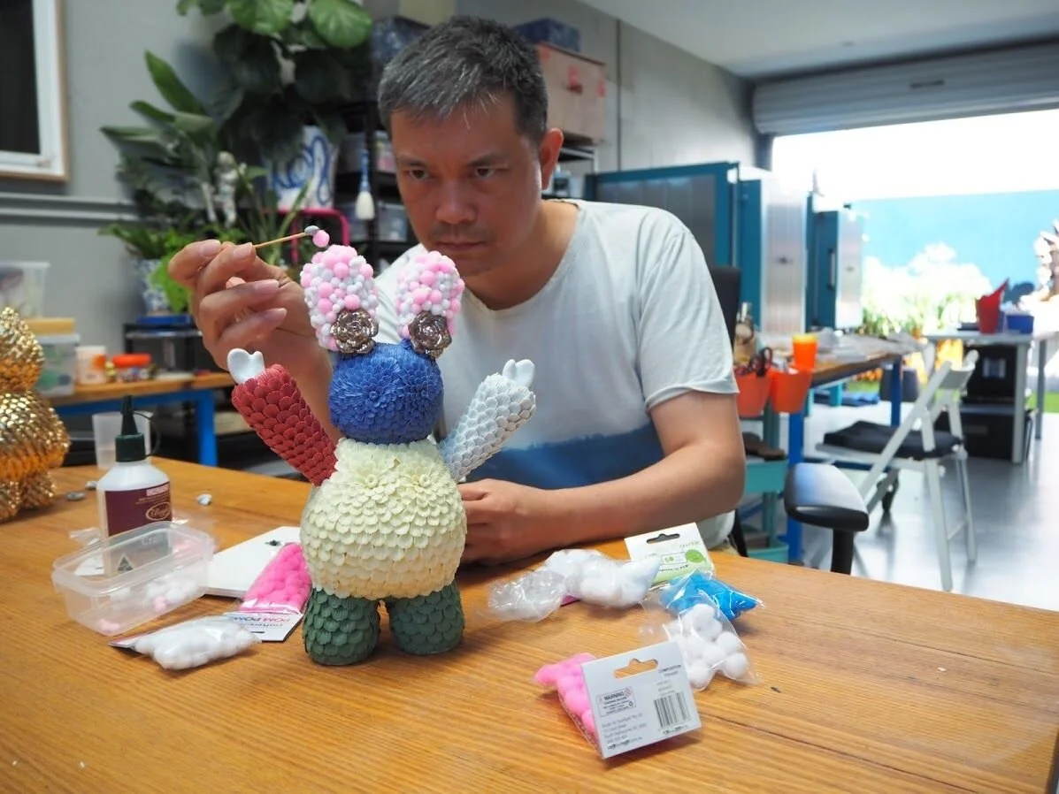 Vipoo Srivilasa working in his studio