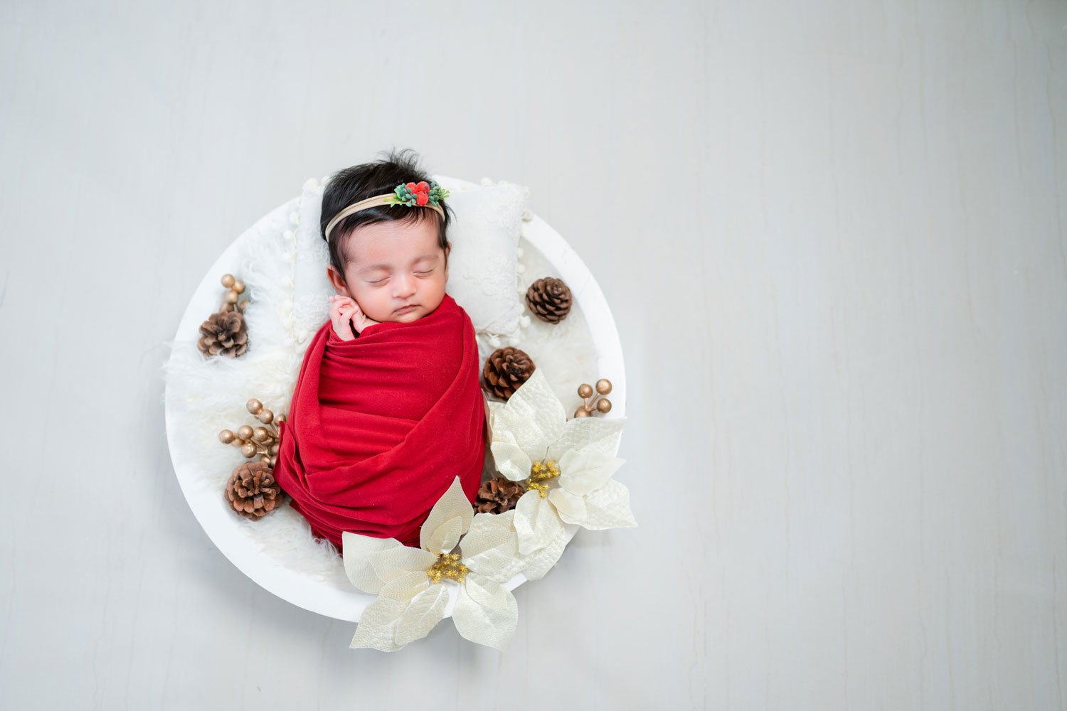 newborn-baby-in-red-and-white.jpg
