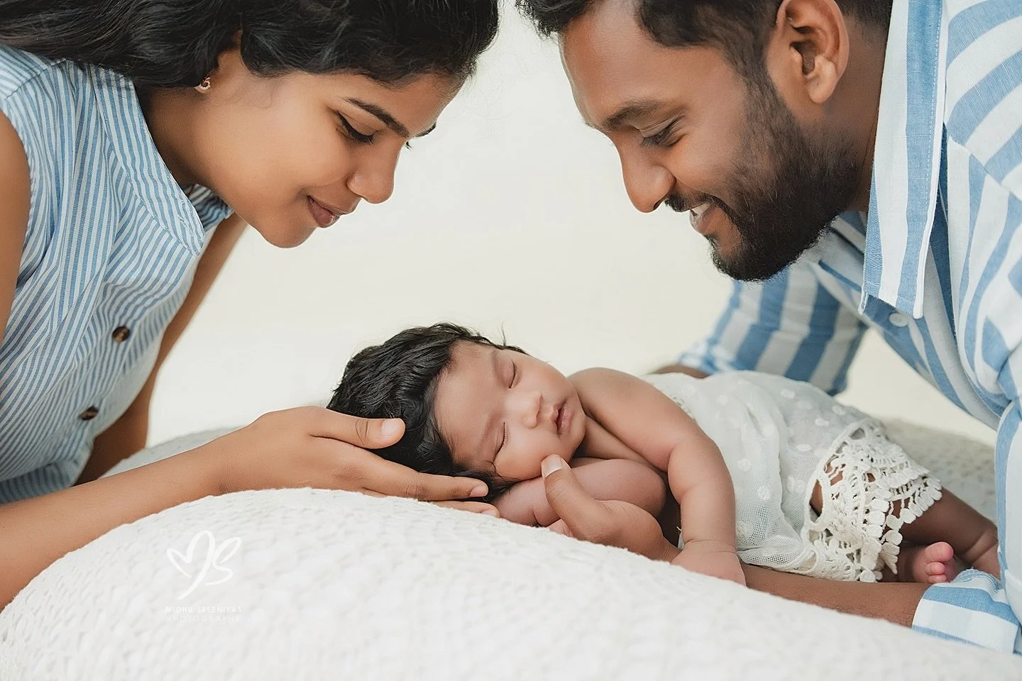 Capturing that beautiful, new parent glow and the quiet wonder of a newborn. Schedule your session before your little one arrives to ensure availability!