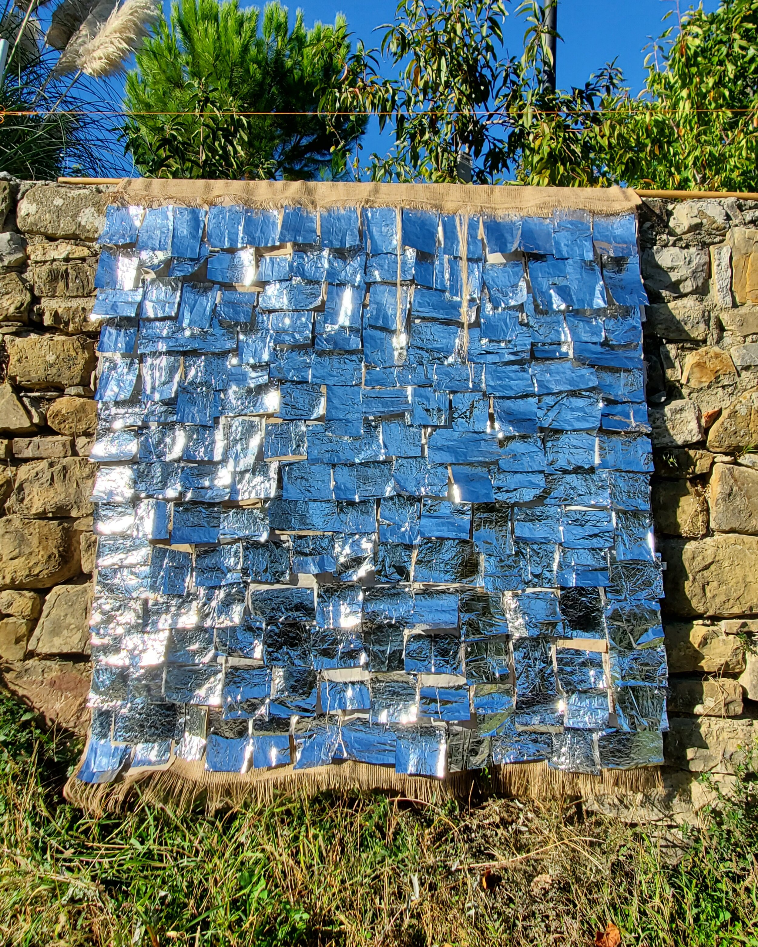 coperta per tutti (a blanket for everyone) 2019, shown with cerulean sky reflection 