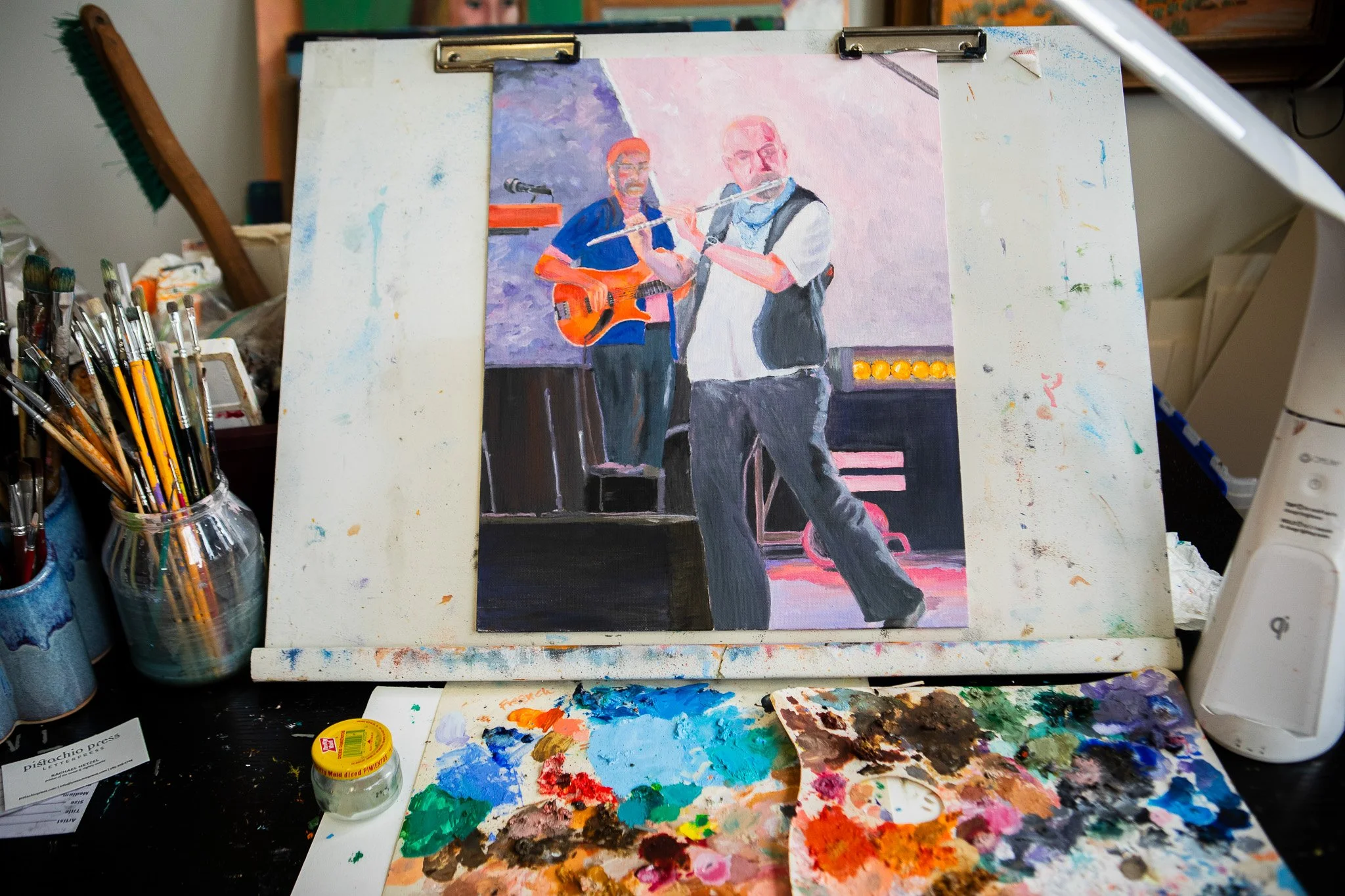 A painting of two musicians performing on stage, one playing guitar and the other playing the flute, with a colorful background and stage lights.