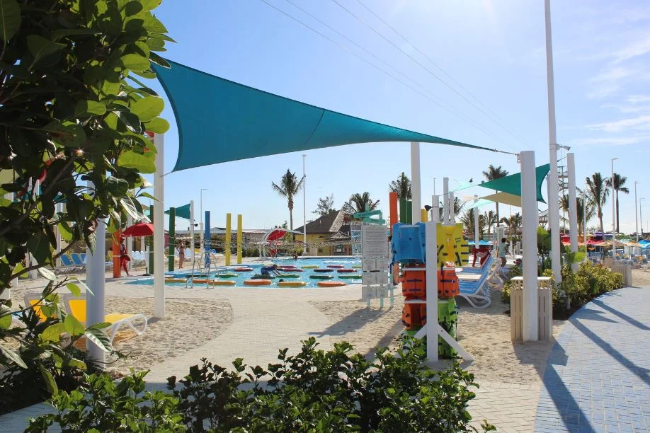 The adventure pool is filled with fun activities including lily pad obstacle courses, rock climbing walls and rope swings.