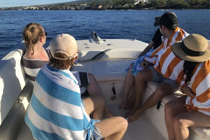 Five of us fit comfortably on the βUβ shaped bench at the bow of the boat as we searched for dolphins.