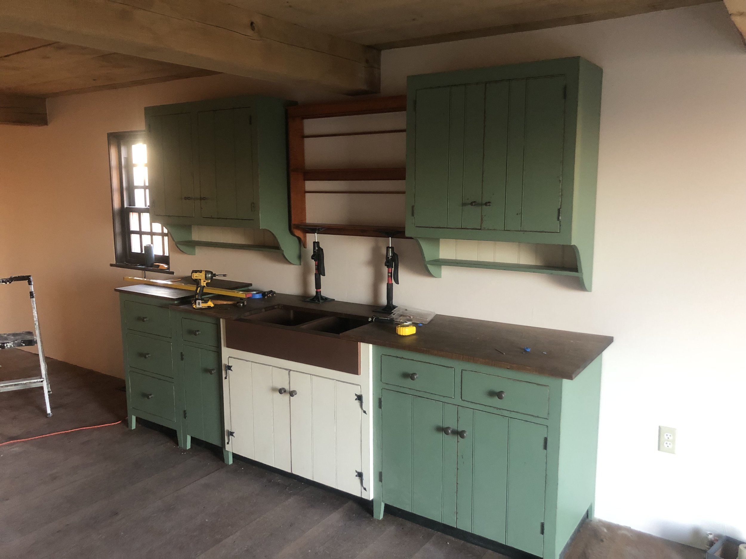 Professional kitchen cabinet installation - bespoke cabinets installed by craftsmen