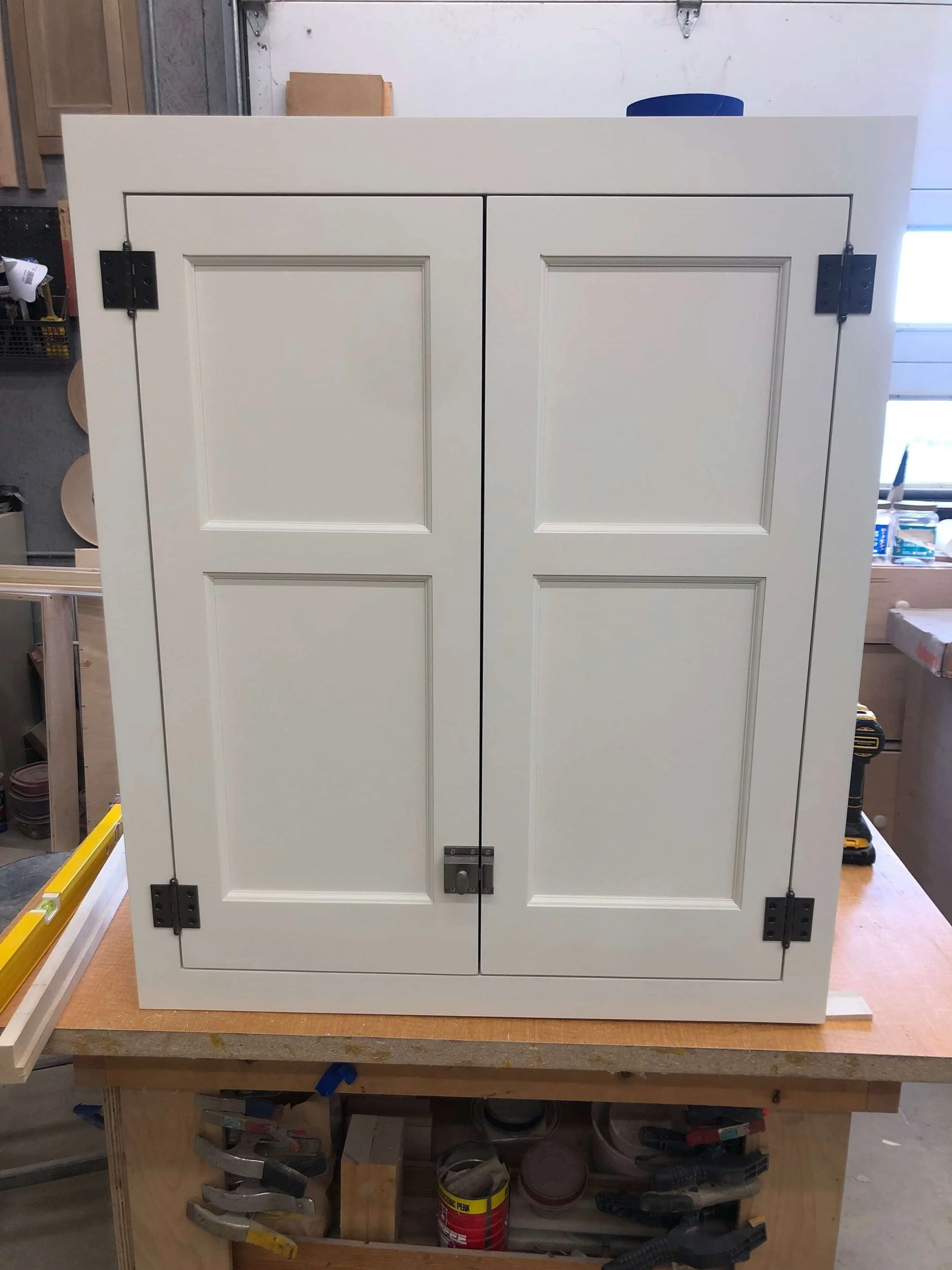 Handcrafted raised panel cabinet door with solid hardwood frame showing traditional joinery craftsmanship