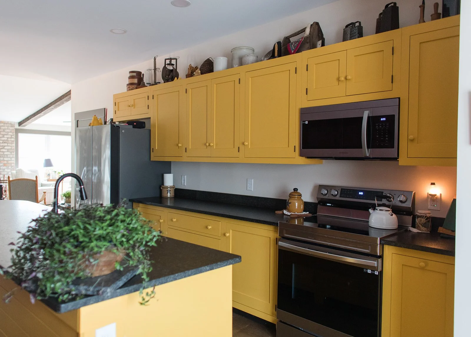 Custom Shaker kitchen cabinets with recessed panel doors wooden knobs and traditional frame-and-panel construction