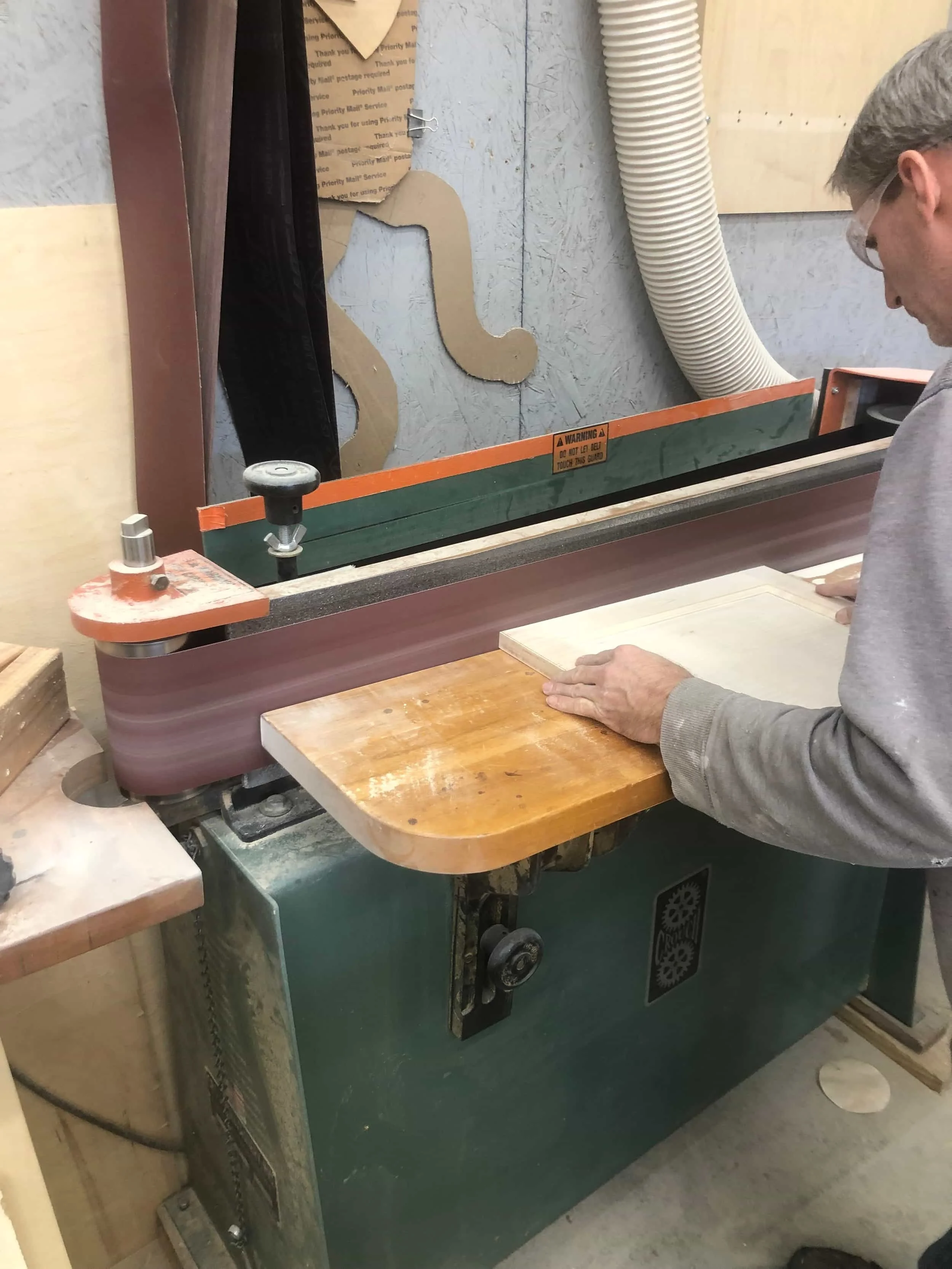 Cabinetmaker building custom kitchen cabinets in Ohio workshop