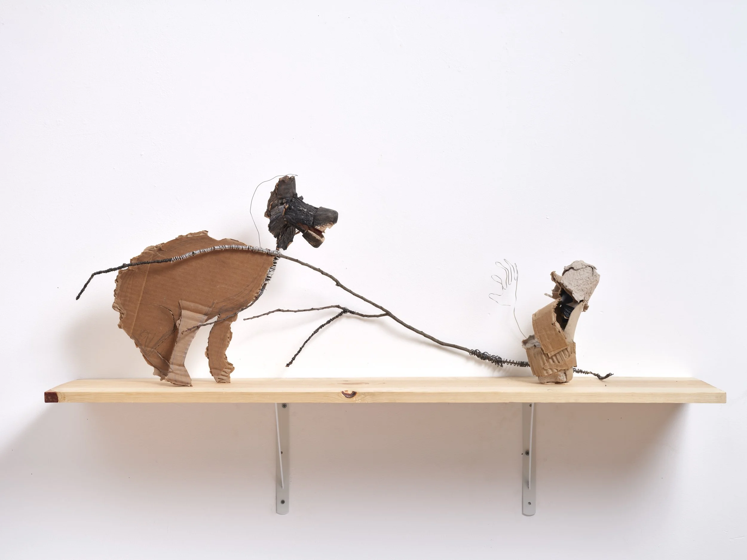 Big Bad Wolf: Back Off!, 2025, cardboard, acrylic, stick, and wire, 16 x 40 x9
