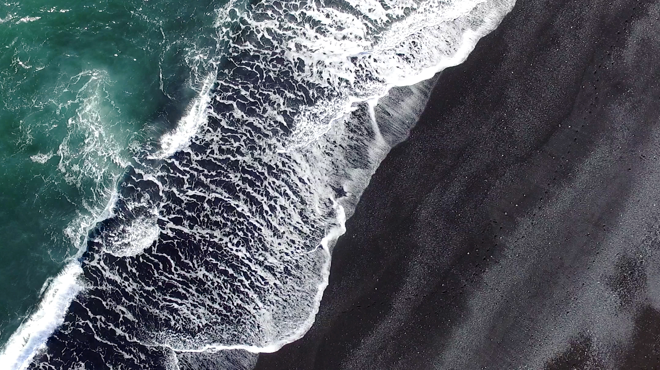 black-sand-beach-at-iceland-546785260_2164x1216.jpeg