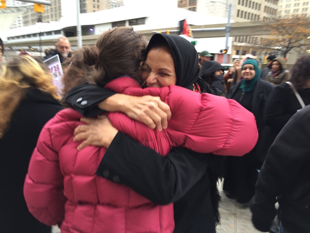 Rasmea Odeh, Palestinian-American icon, hugs one of her supporters following the jury selection. Her trial will continue at the Theodore Levin Court House on Nov. 5.