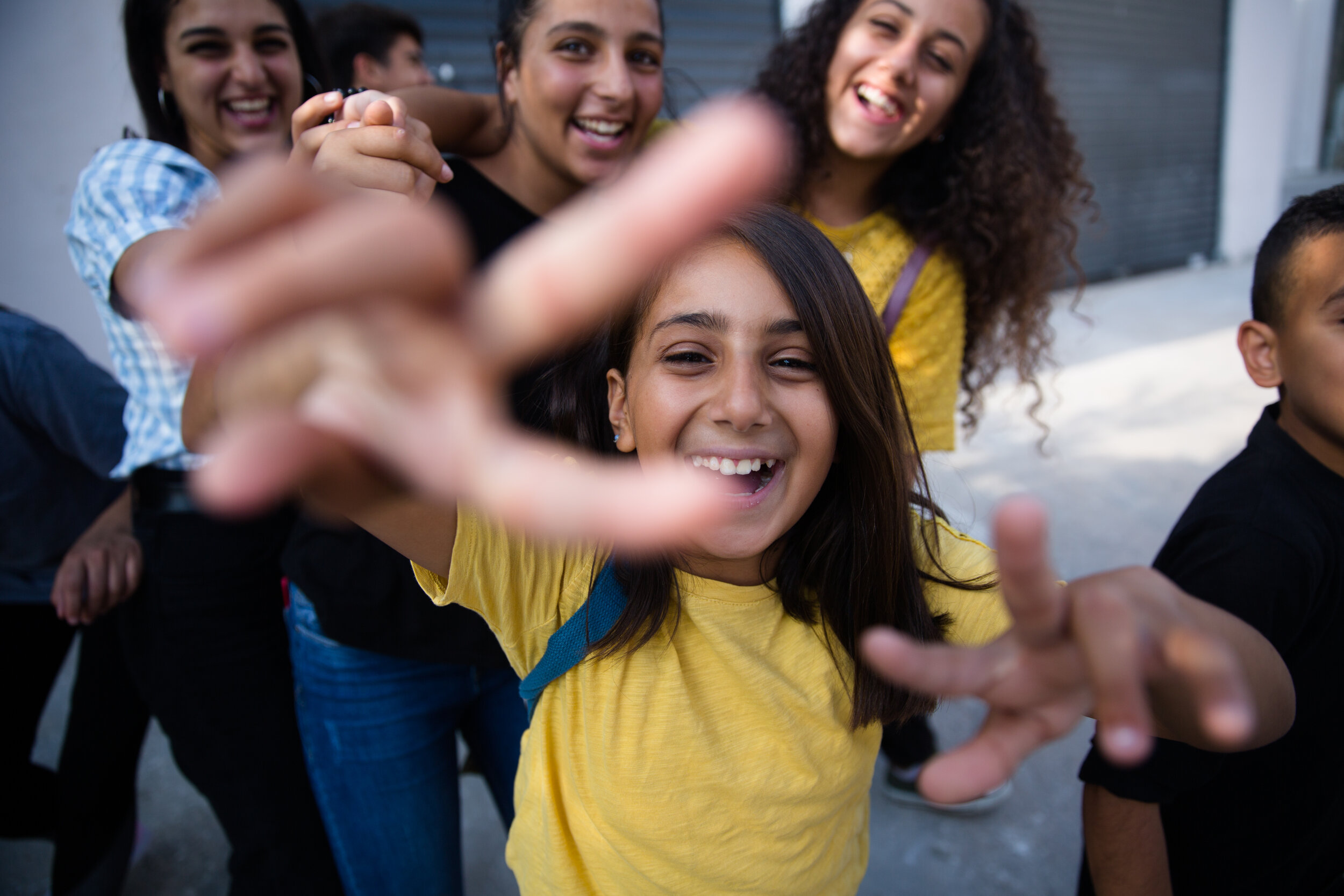  Youth play and pose for portraits in the Dheisheh Refugee camp immediately after a dabke performance at the Shoruq Organization community center in Bethlehem, Palestine, Tuesday, Aug. 20, 2019. 