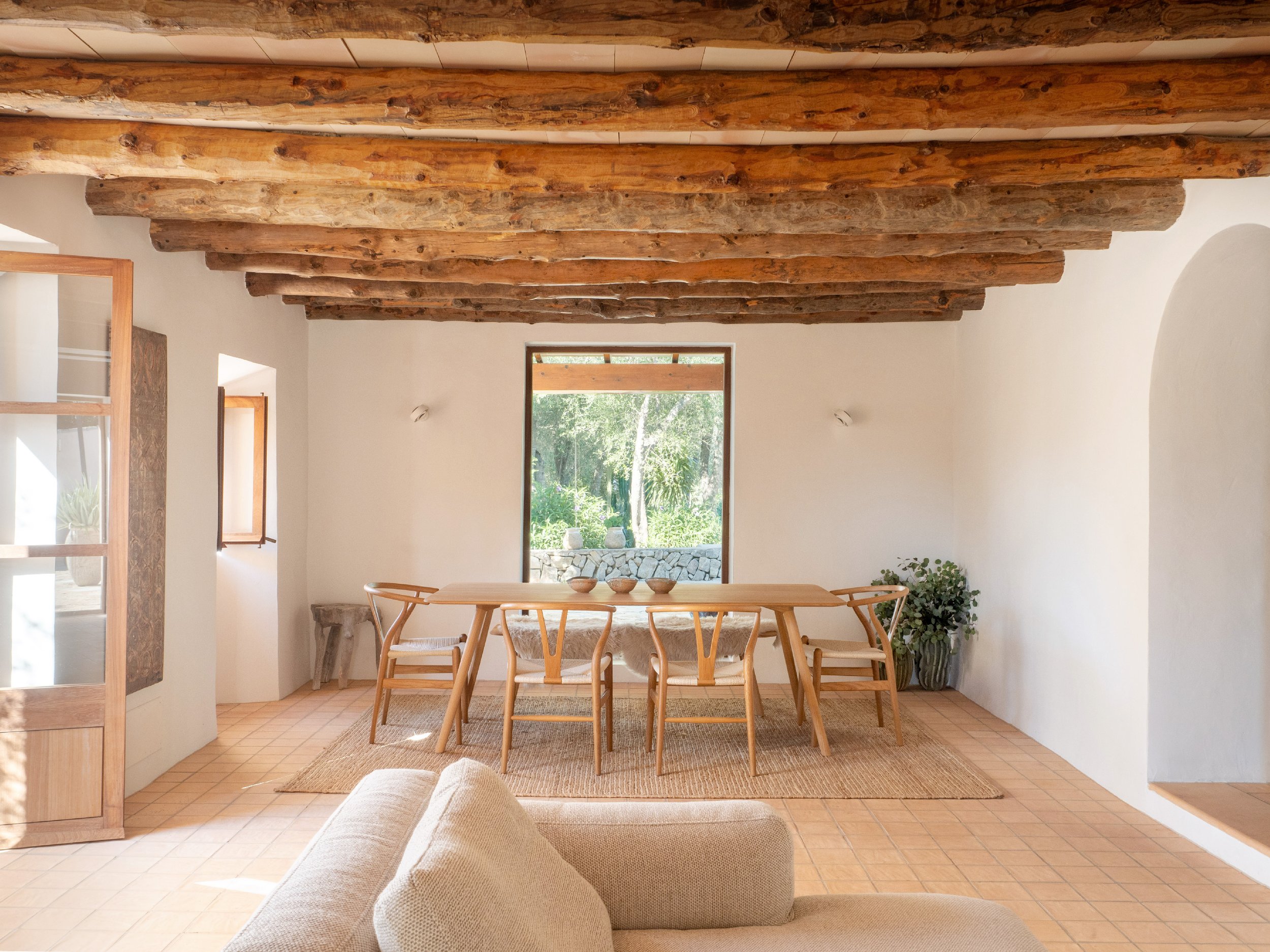 Finca renovation Felanitx Mallorca. Original timber beams, terracotta floors, vintage furnishings.