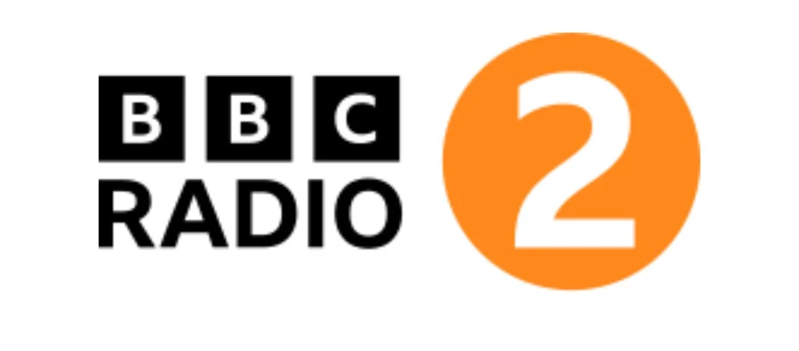 The BBC Radio 2 logo. BBC RADIO in black text, with a white number 2 in an orange circle
