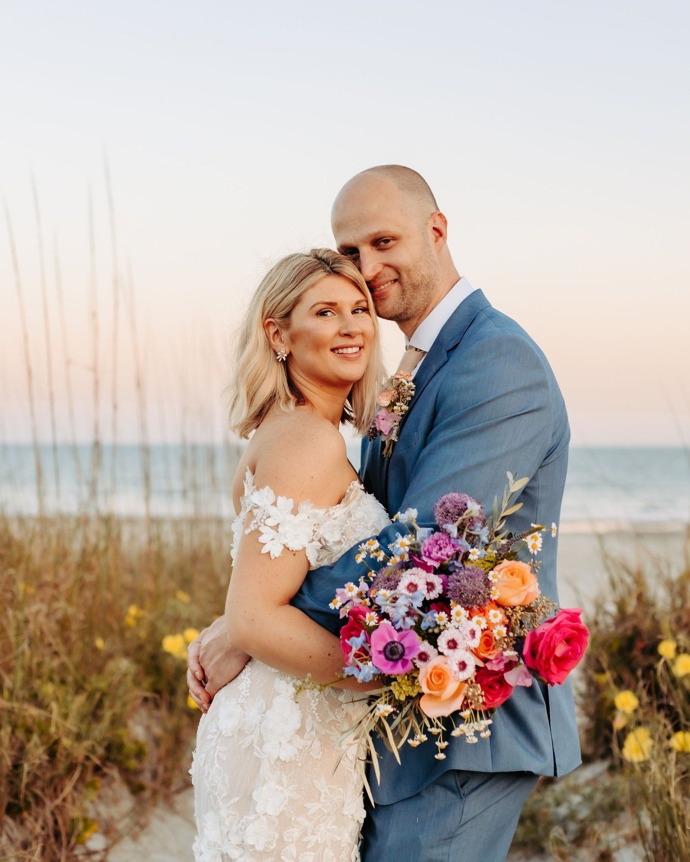 Capturing the essence of coastal charm and the vivid spirit of love, these beach wedding blooms radiate with vibrant energy and unmatched beauty. Every detail of this special day is adorned with bright, bold florals...from the gorgeous arch to the br