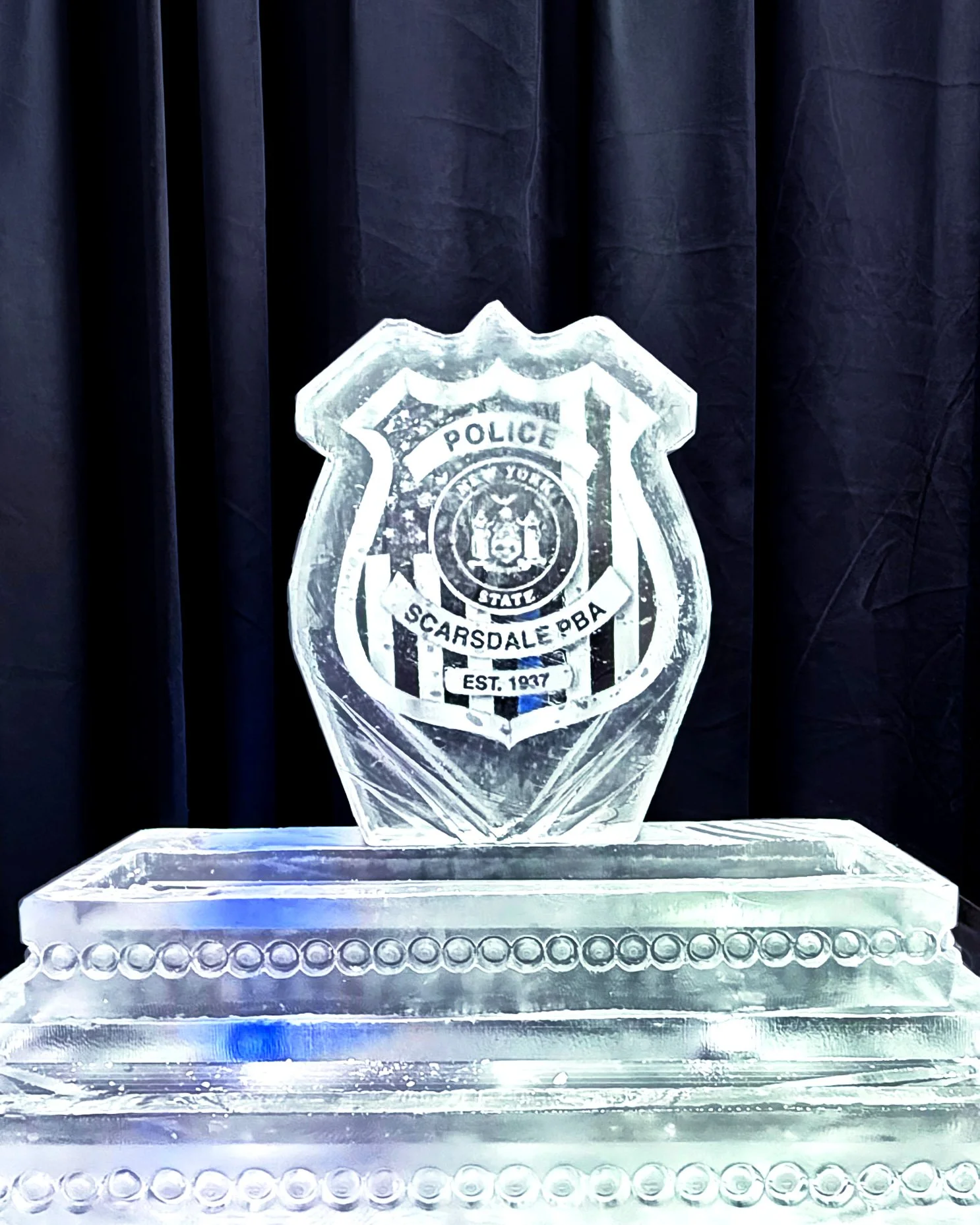 100226-police-badge-step-tier-rawbar.jpg